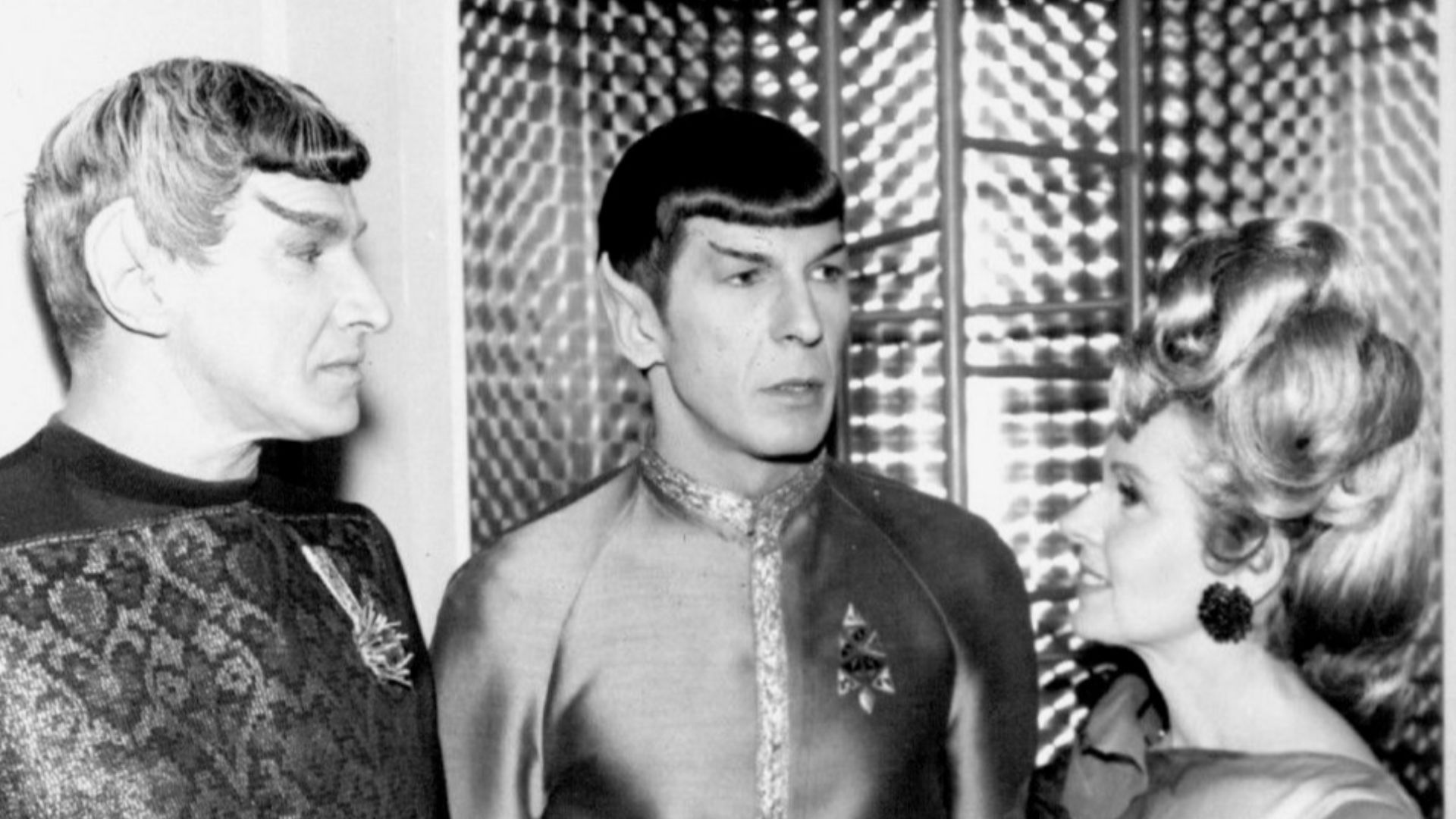 Photo of Mr. Spock with his parents.  At left is his father, Sarek, a Vulcan (played by Mark Lenard) and at right, his human mother, Amanda (played by Jane Wyatt). His parents appeared in the episode Journey to Babel.