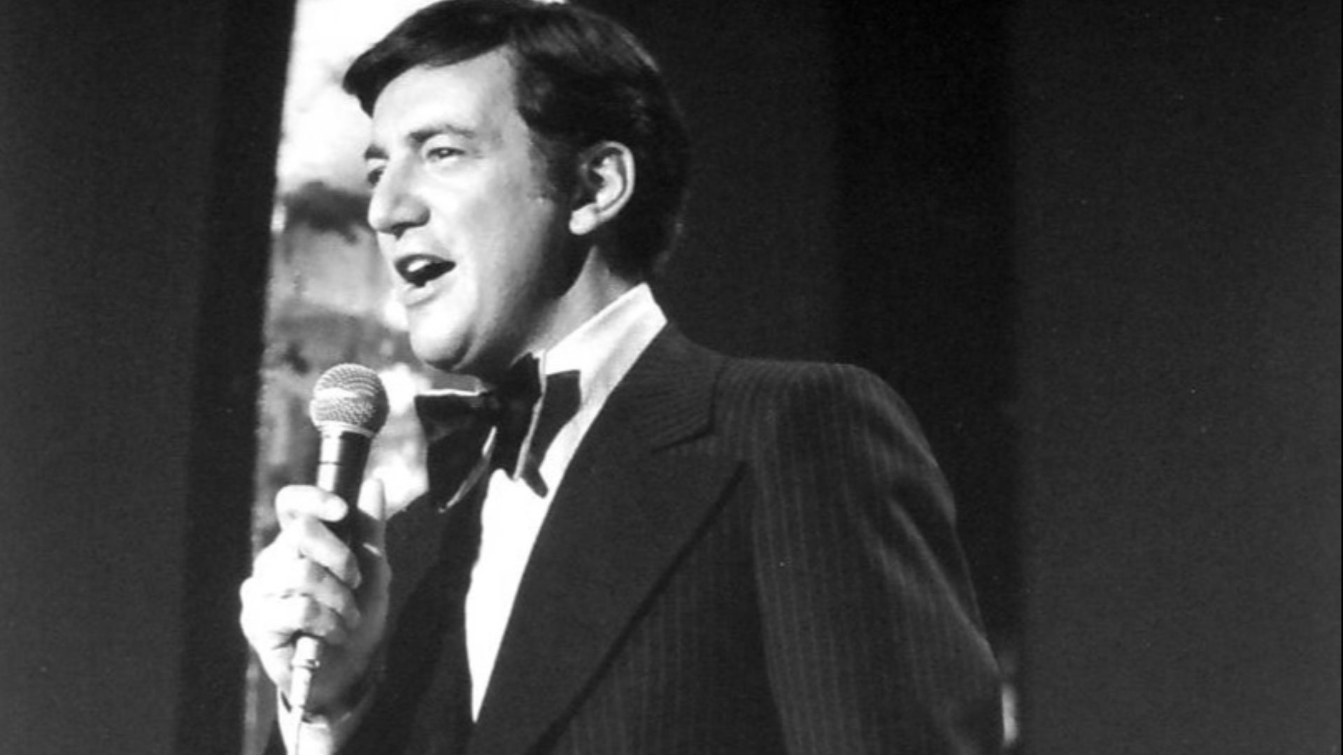 Photo of Bobby Darin performing.  Darin's own television show began when he hosted a summer replacement program for The Dean Martin Show.