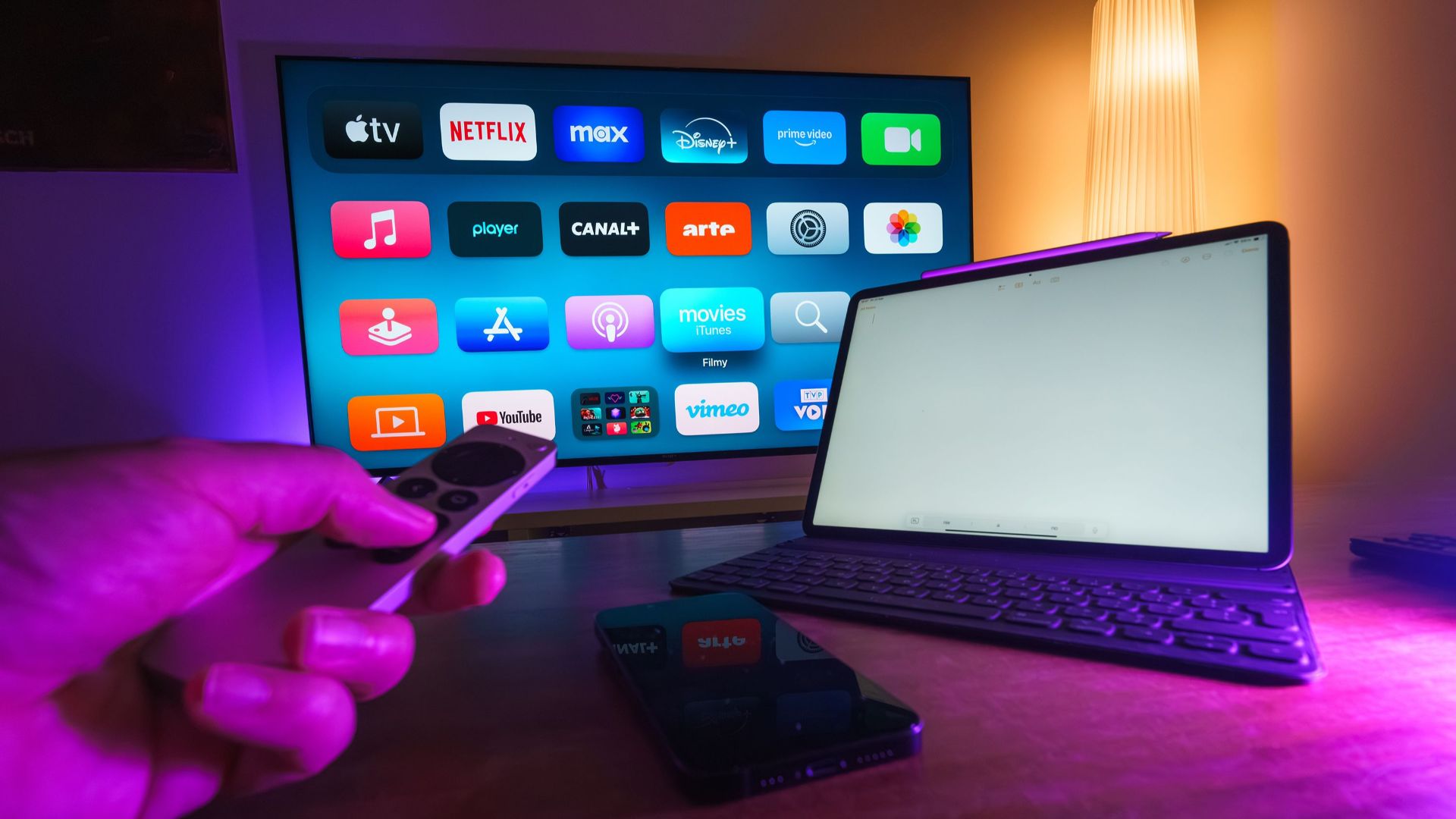 A cozy home setup featuring streaming services on smart TV, tablet, and smartphone.