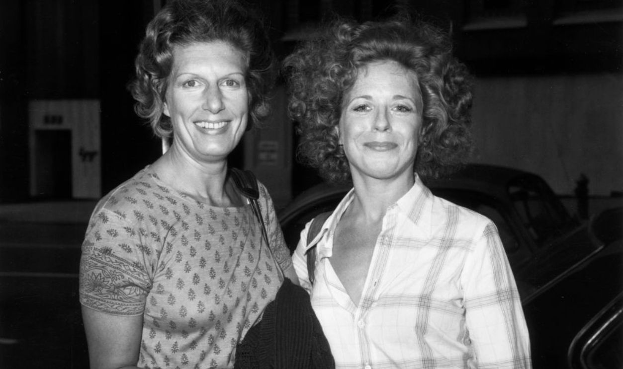 August 1975: American actors Nancy Marchand (left, 1928-2000) and Holland Taylor pose outdoors on the set of their television series, 'Beacon Hill'.