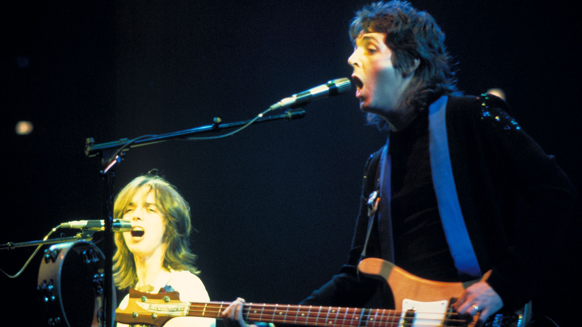 Paul McCartney (right) and Jimmy McCulloch during a Wings concert.