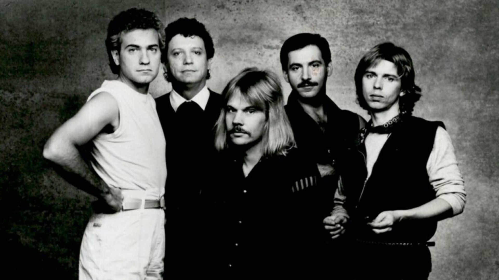 Muscial group Styx, in a 1983 publicity photo. Pictured from left to right; Dennis De Young, John Panozzo, James Young, Chuck Panozzo, and Tommy Shaw.
