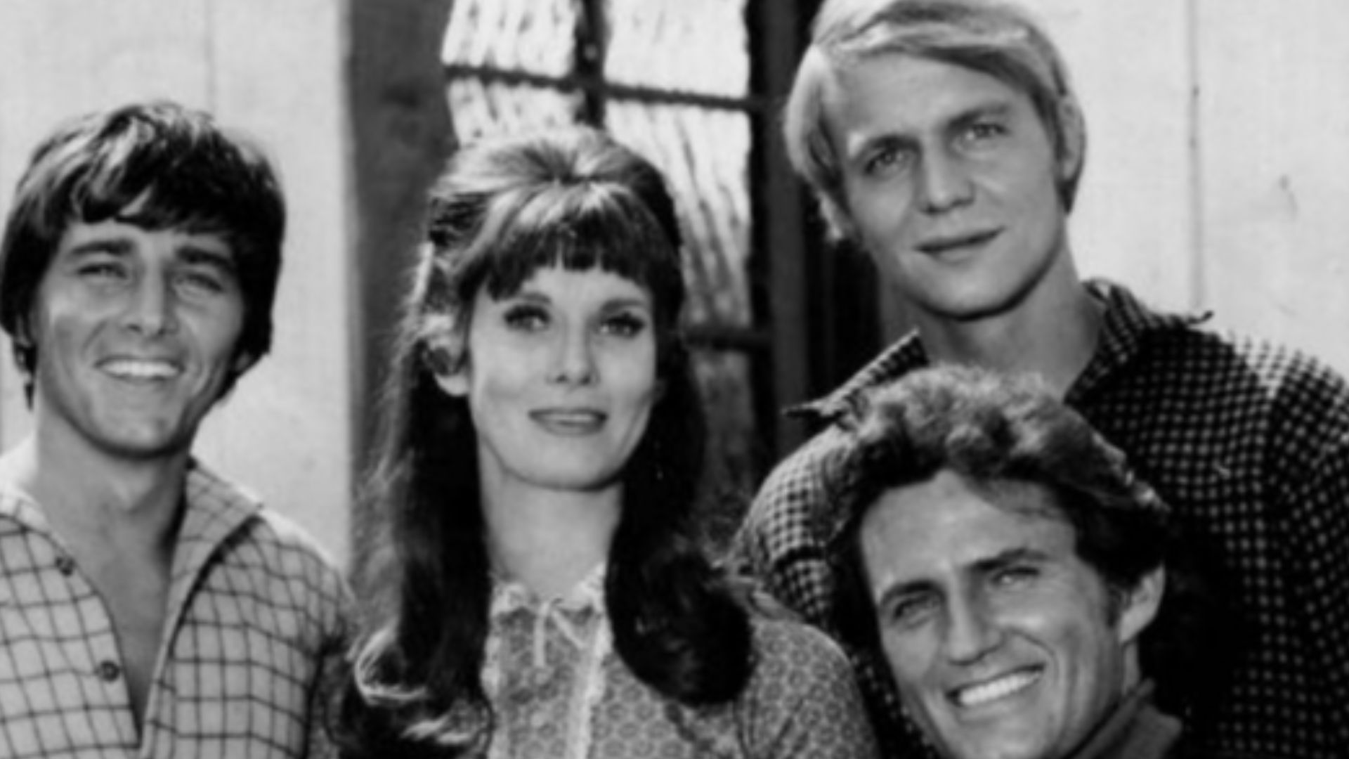 Cast photo from the television program Here Come the Brides.  Clockwise from left: Bobby Sherman, Bridget Hanley, David Soul, Robert Brown, Joan Blondell.