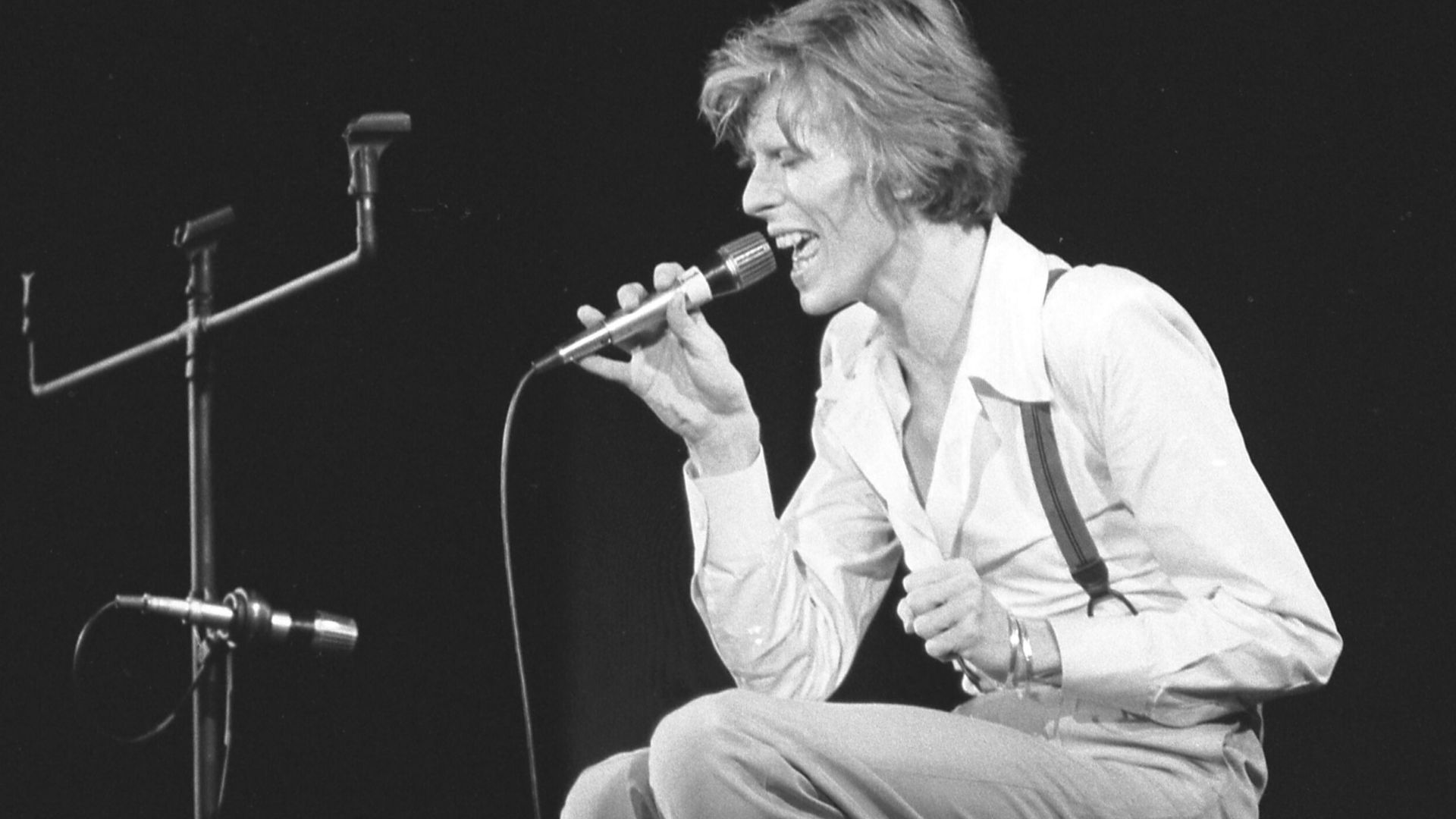 Eschewing special effects for this number, rock singer David Bowie establishes a mood in concert at Amphitheater.
