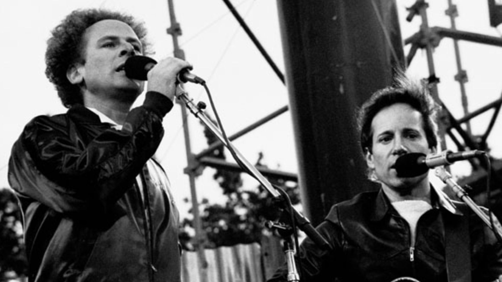 Singer-Songwriter duo Simon & Garfunkel performing outside at a concert in Dublin