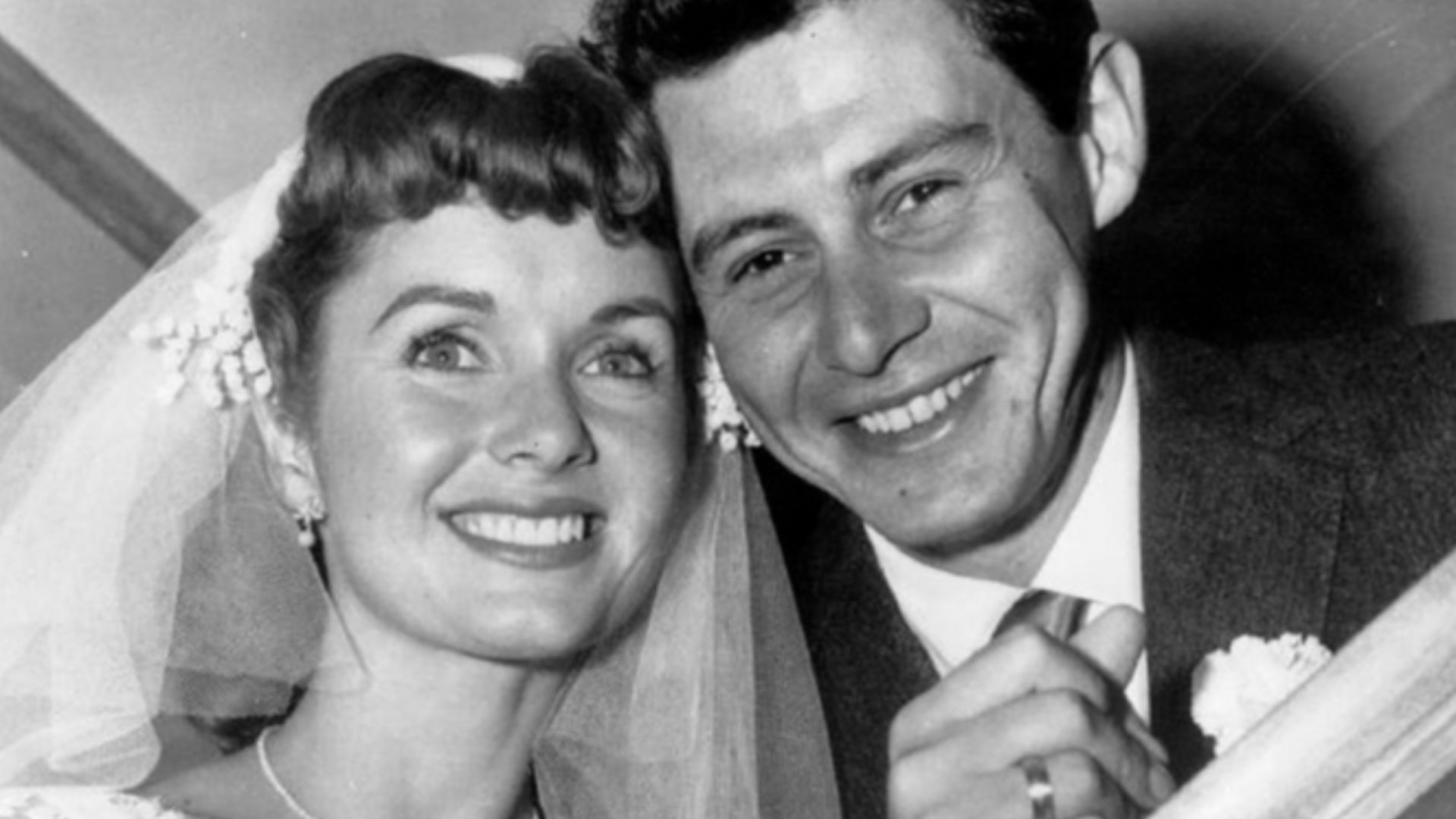 Press photo of Debbie Reynolds and Eddie Fisher at their wedding.