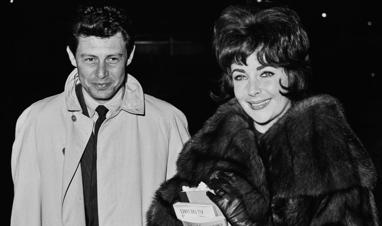 Eddie Fisher And Elizabeth Taylor American singer Eddie Fisher (1928 - 2010) and his wife, actress Elizabeth Taylor (1932 - 2011), arriving at London Airport on January 5th, 1961.