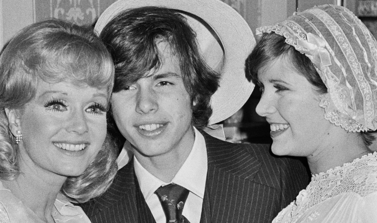Debbie Reynolds And Children From left to right, American actress and singer Debbie Reynolds (1932 - 2016) with her son Todd Fisher and daughter Carrie Fisher (1956 - 2016), UK, 31st July 1974. Reynolds is in the UK to perform at the London Palladium. 