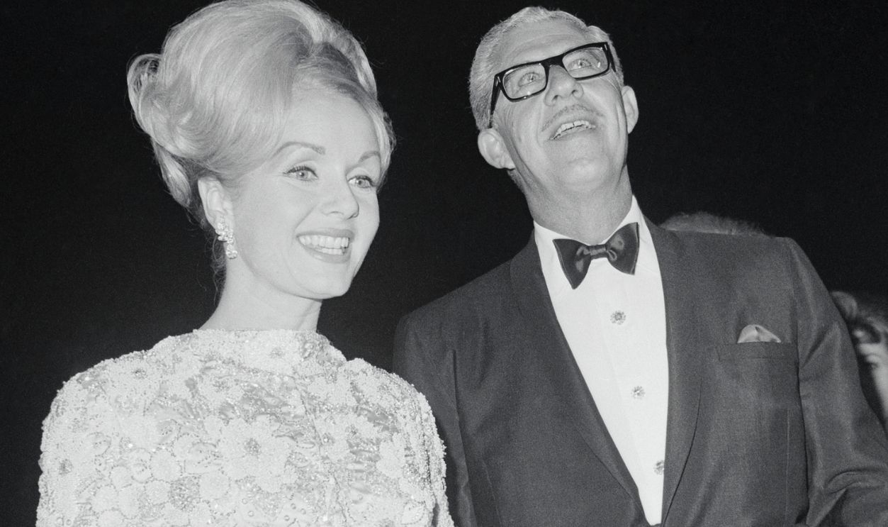 Debbie Reynolds Arriving at Academy Awards (Original Caption) Santa Monica, Calif.: Actress Debbie Reynolds and husband, Harry Karl, arrive for the 37th Annual Academy Awards. Miss Reynolds is a nominee for an Oscar for Best Performance by an actress for her role in The Unsinkable Molly Brown.