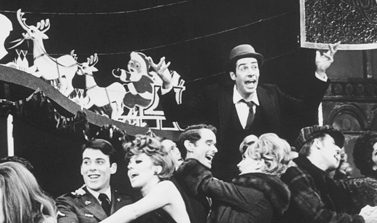 (Original Caption) New York: Jerry Orbach (hands upraised) in a production number from the Broadway stage musical, Promises, Promises.