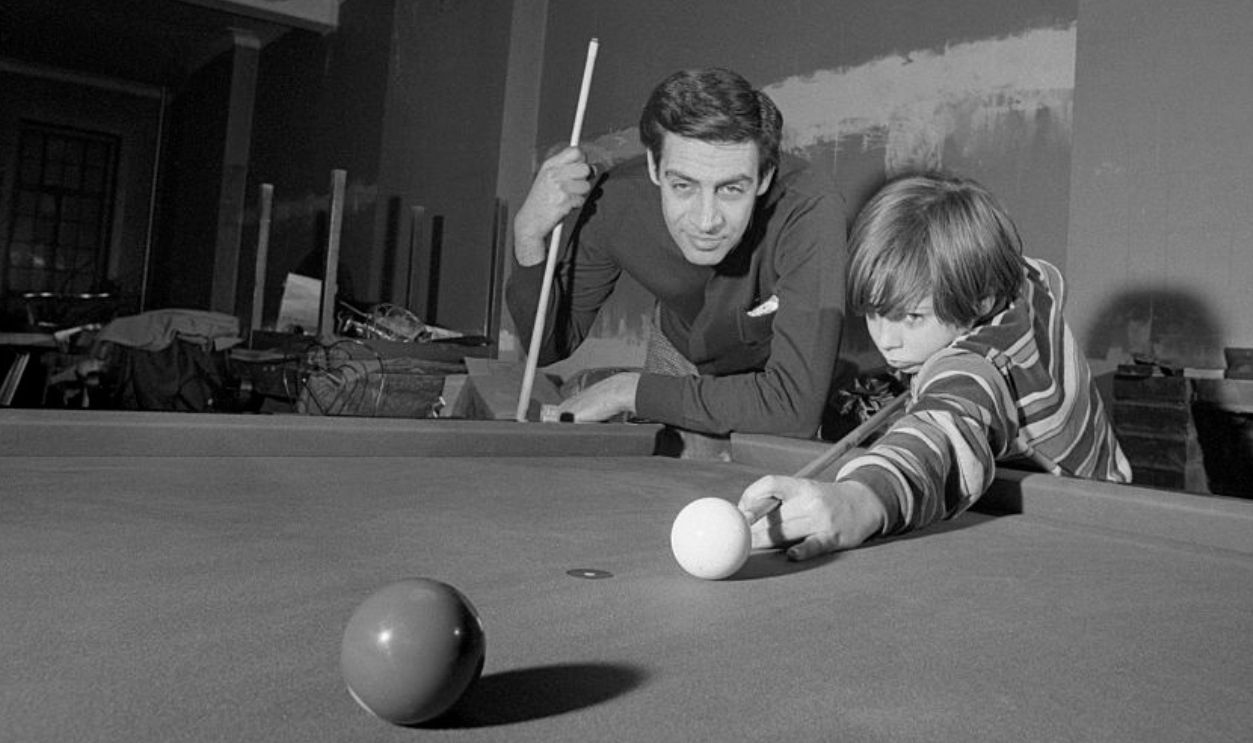(Original Caption) Orbach On Top. Jerry Orbach is a die hard pool player. His son Tony is fast following in dad's footsteps and doing splendidly at it.
