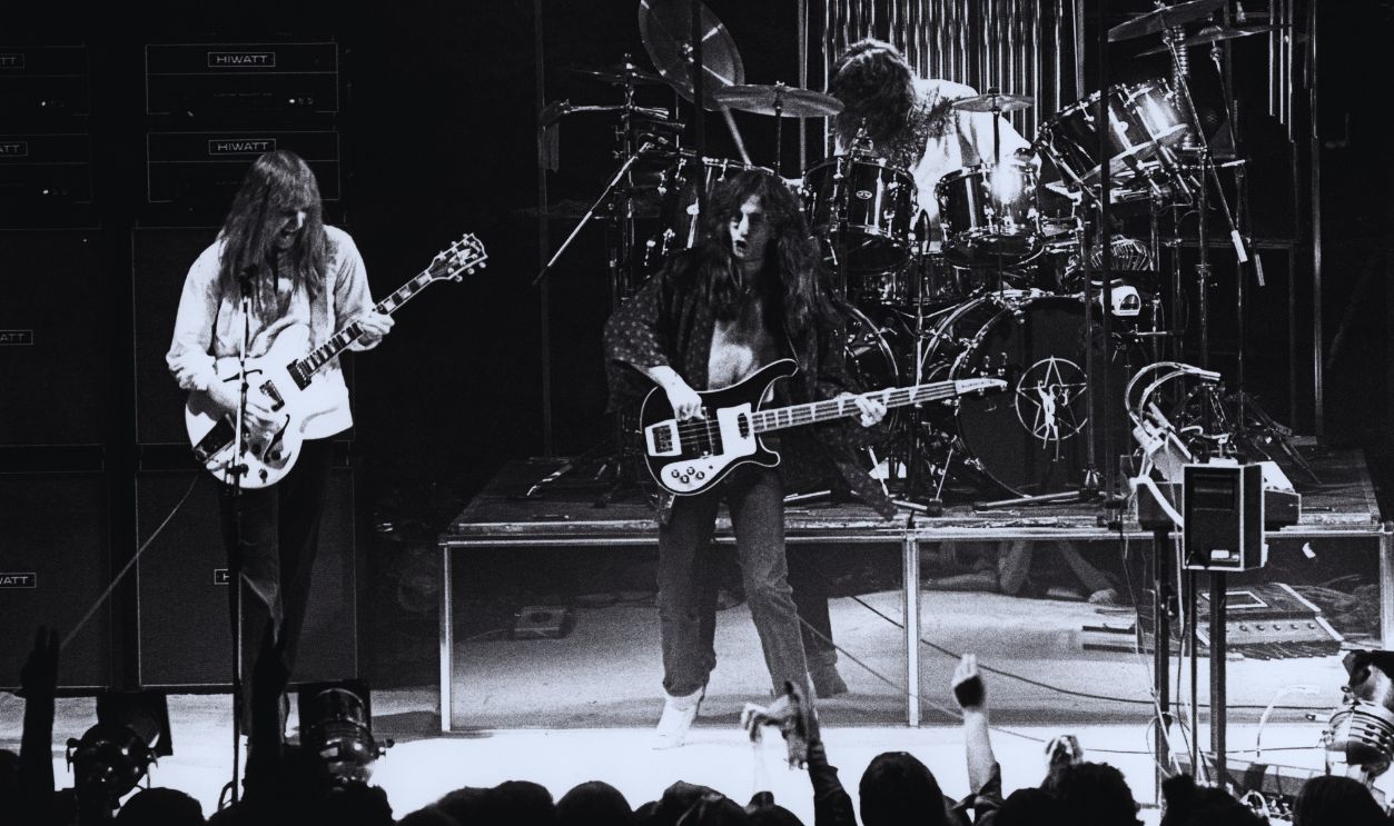 Gettyimages - 84882662, Photo of Geddy LEE and RUSH and Neil PEART and Alex LIFESON UNITED KINGDOM - FEBRUARY 12: BIRMINGHAM Photo of Geddy LEE and RUSH and Neil PEART and Alex LIFESON, L-R: Alex Lifeson, Geddy Lee, Neil Peart (drums) performing live onstage at the Birmingham Odeon on A Farewell To Kings tour