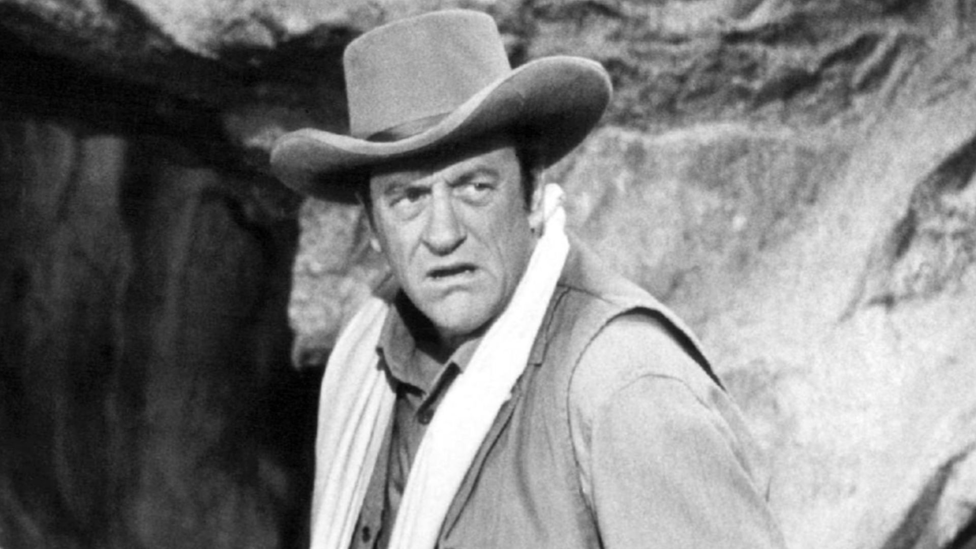 Photo from the television program Gunsmoke.  Pictured are guest star Dennis Redfield (left) as Lem and James Arness as Matt Dillon.