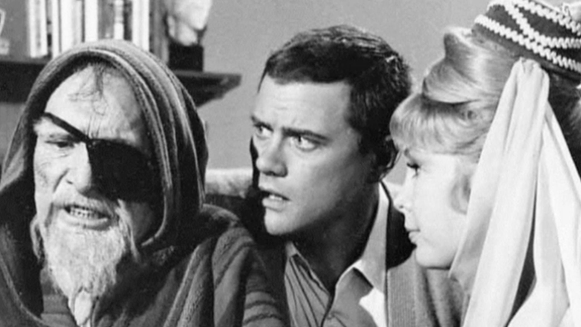 Photo of J. Carrol Naish, Larry Hagman and Barbara Eden from the television program I Dream of Jeannie.  Naish guest stars as Jeannie's grandfather, Bilejik, who visits to show Tony (Hagman) how to desalinate water. The episode title is Djinn and Water.