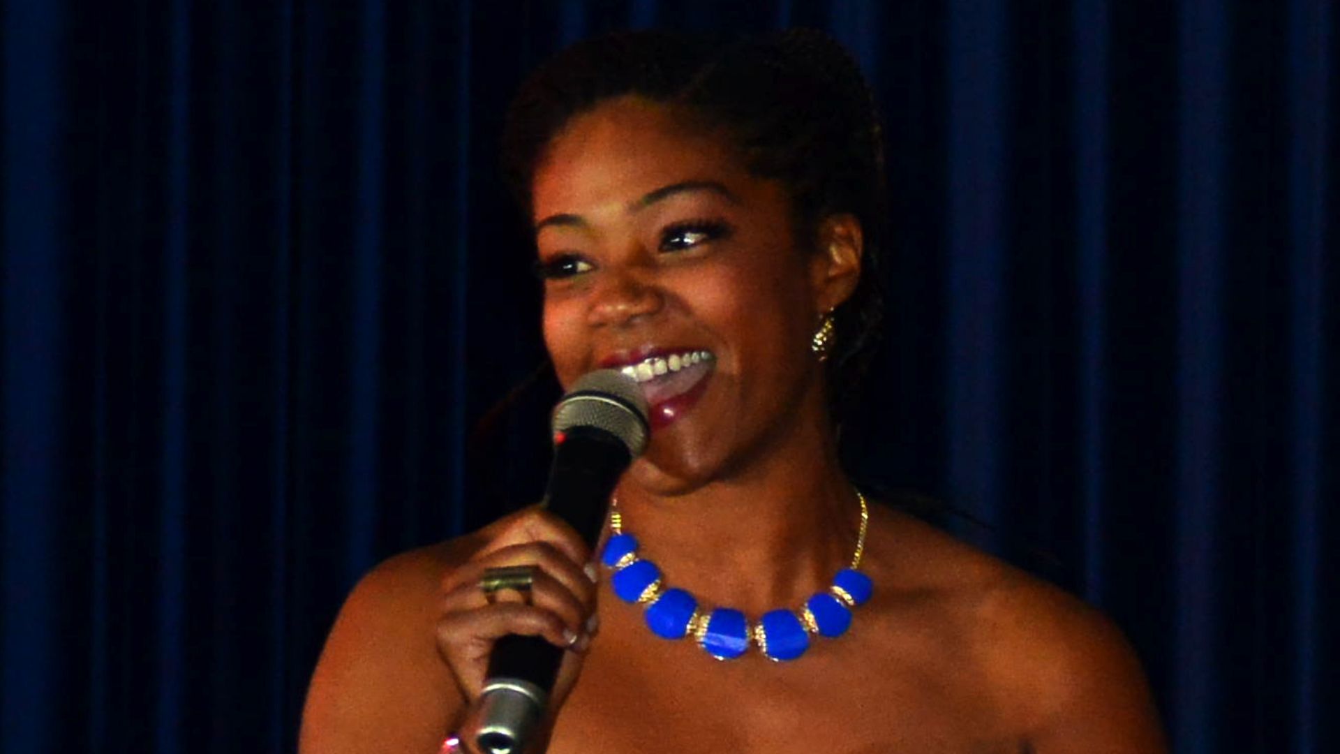 Tiffany Haddish, comedian, tells jokes to audience members during a performance October 21, 2013, at Incirlik Air Base, Turkey. Her act was part of a tour sponsored by Armed Forces Entertainment to provide comedic relief to service members overseas.