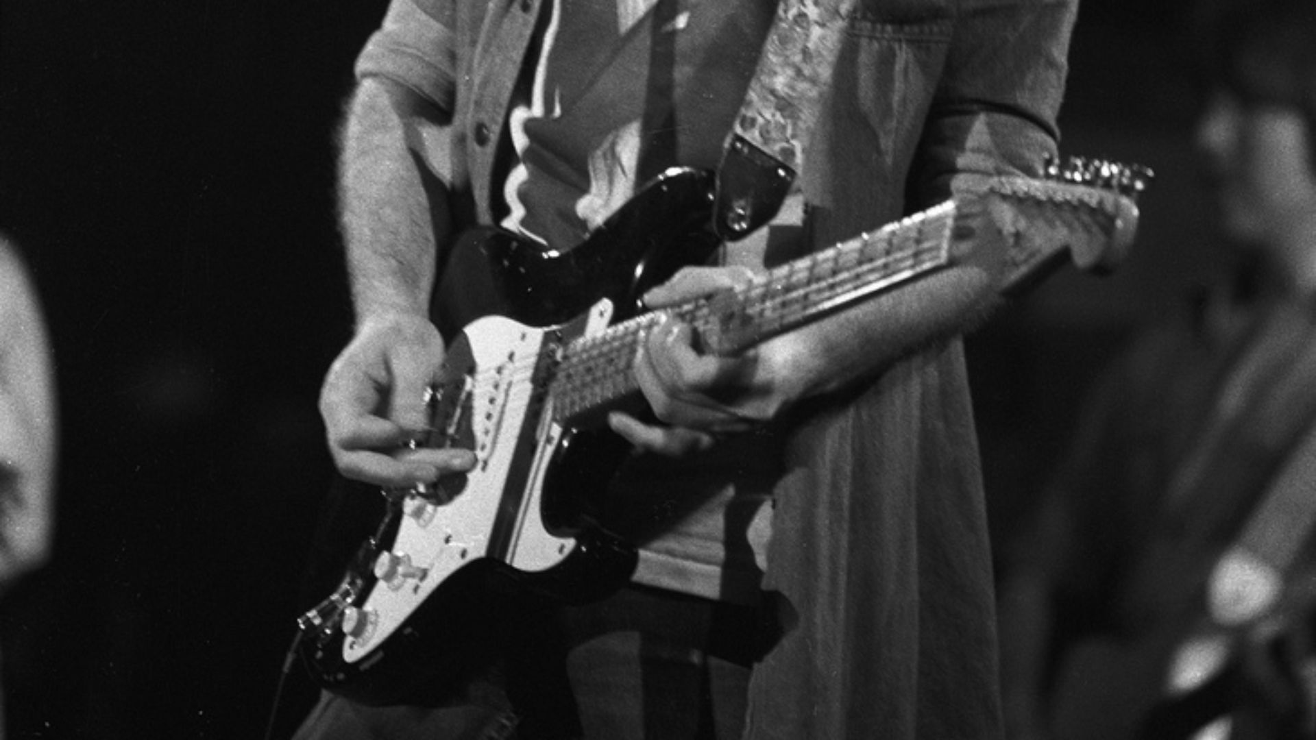 Eric Clapton - Swing Auditorium, San Bernardino, CA, There's One In Every Crowd Tour.
Aug. 15, 1975, Monochrome Frame 17.
Reduction of Tri-X Negative scan at 4000dpi. Shot with an Asahi Pentax w/200mm telephoto.

He's playing Blackie.