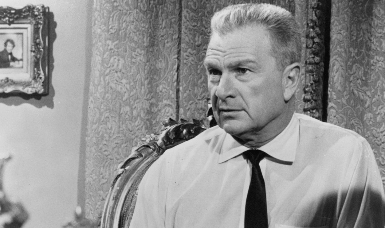 Eddie Albert sitting at the table in a scene from the film 'The Party's Over', 1965.