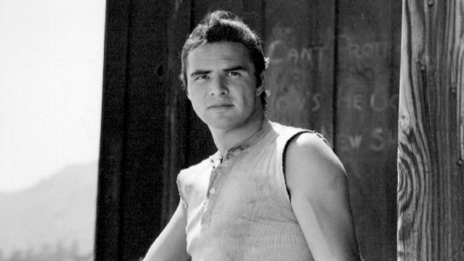 Publicity photo of Burt Reynolds as blacksmith Quint Asper from the television program Gunsmoke.