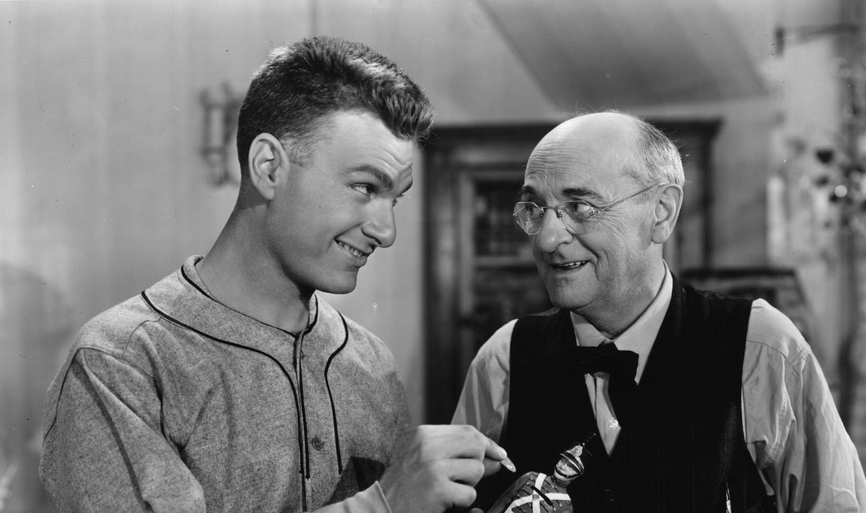 Eddie Albert shows Granville Bates (1882 - 1940) a toy soldier in a scene from the film 'Brother Rat and a Baby ', aka 'Baby Be Good', directed by Ray Enright for Warner Brothers/First National.