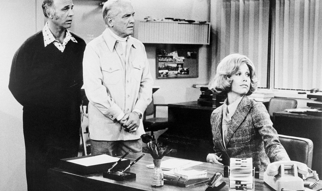 (Original Caption) Left to right: Gavin MacLeod, Ted Knight and Mary Tyler Moore all stare at something off camera in a scene from an episode of The Mary Tyler Moore Show.
