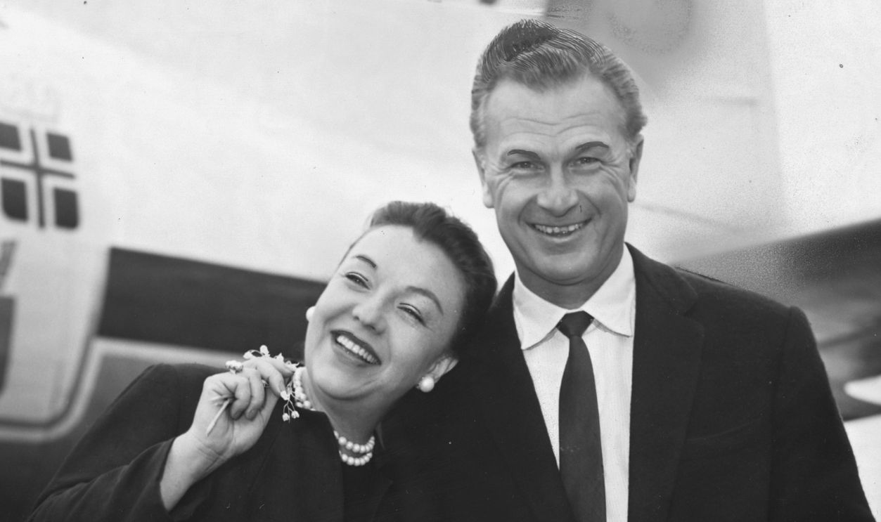 Actor Eddie Albert with his wife Margot and his son Eddie at London Airport, 1957.