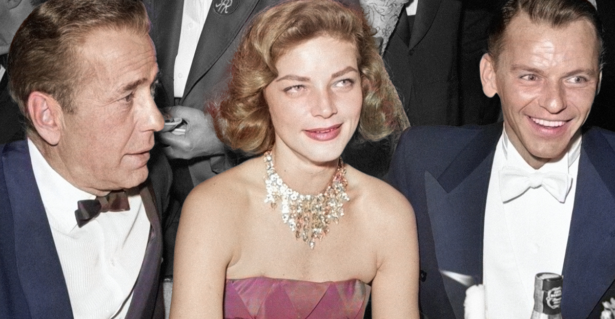 Humphrey Bogart, Lauren Bacall and Frank Sinatra seated together at table during Hollywood event circa 1956.