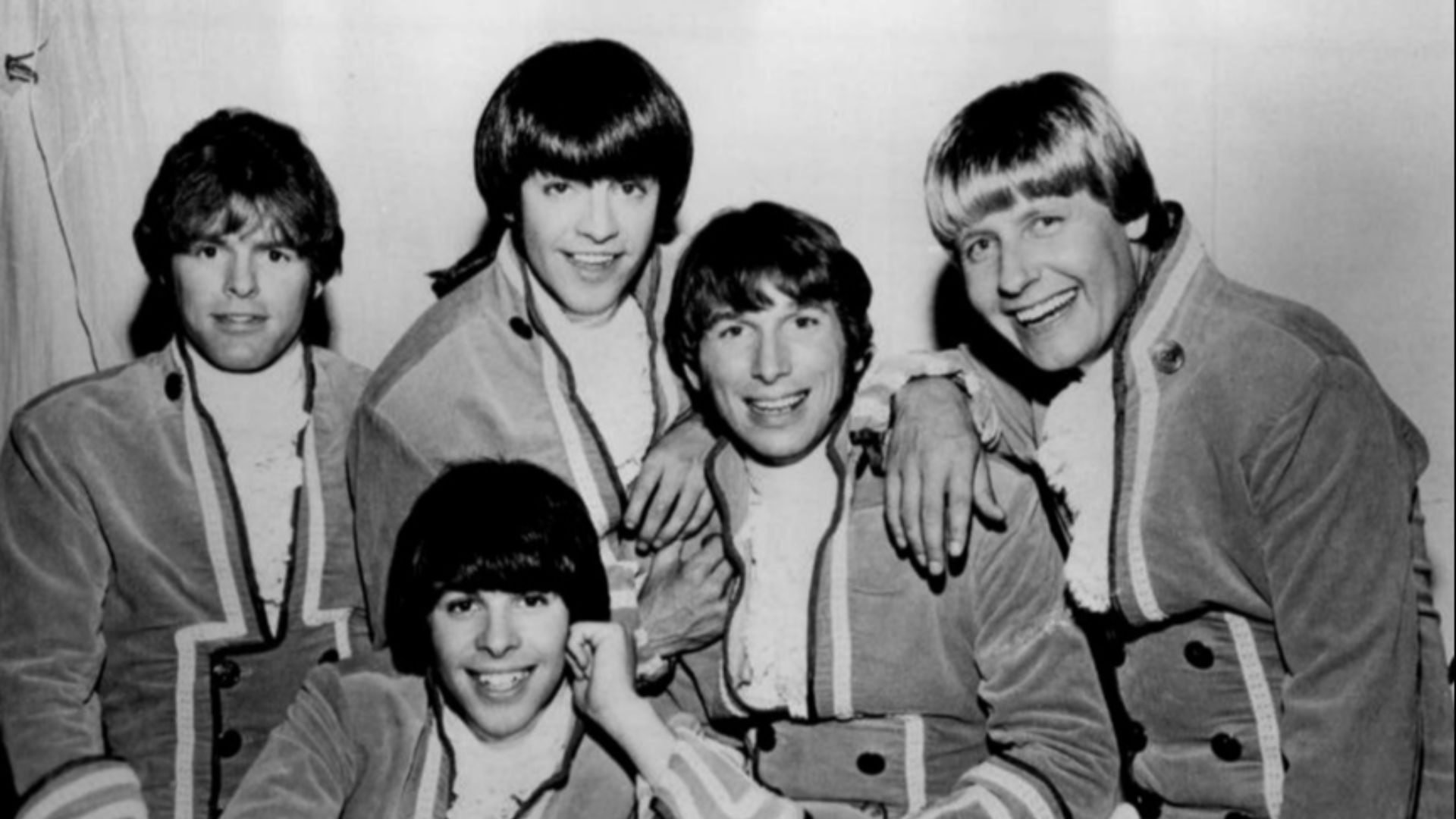 Photo of Paul Revere and the Raiders. Standing from left: Mike