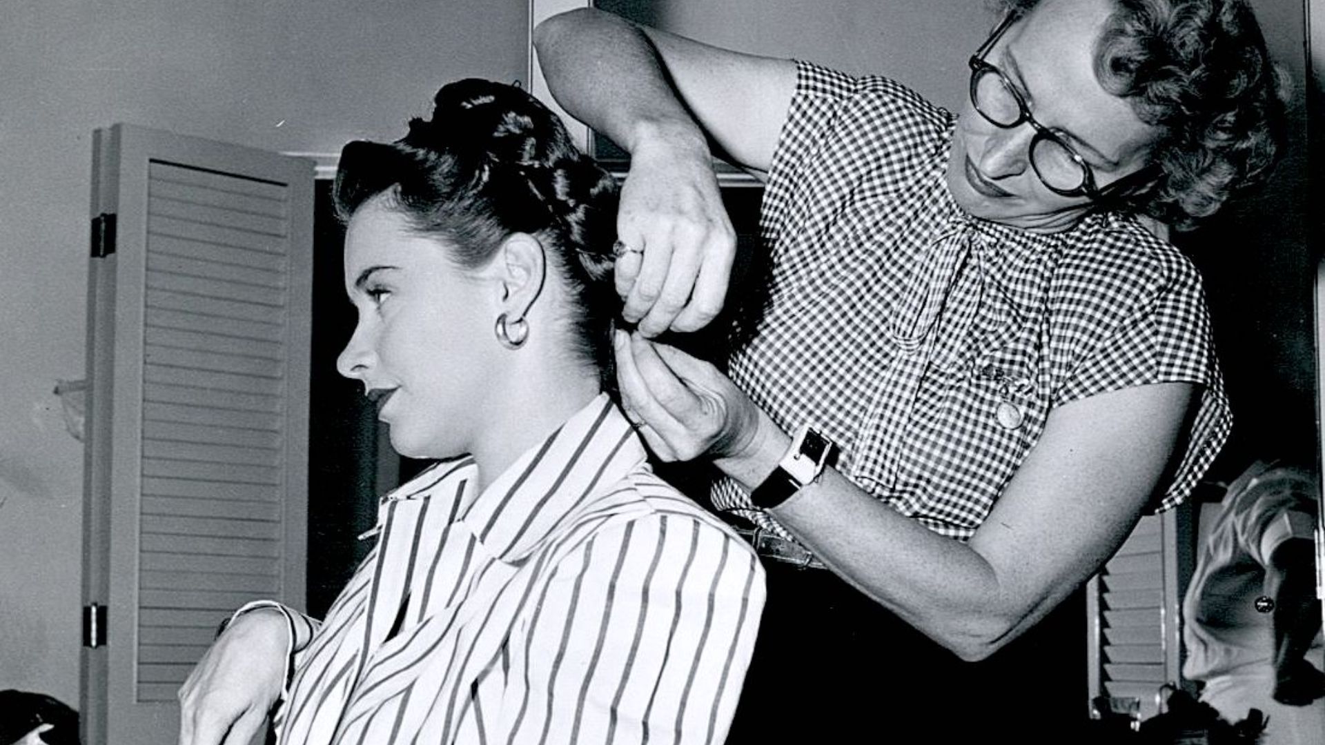 Hairdresser Bert French with actress Susan Peters on set of The Sign of the Ram