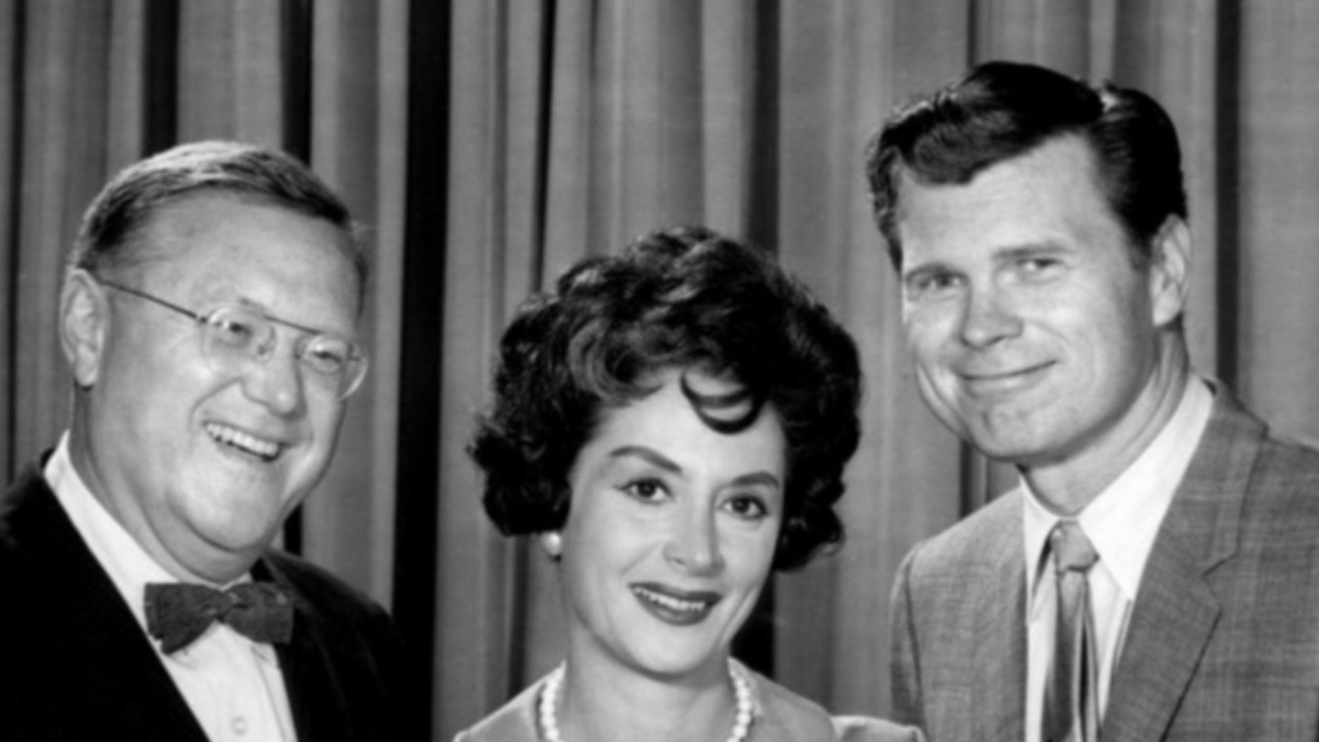 Publicity photo for the daytime version of the television game show To Tell the Truth.  The daytime show initially had different panel members than the nighttime program.  Seated is host Bud Collyer; standing from left: Sam Levenson, Mimi Benzell, Barry N