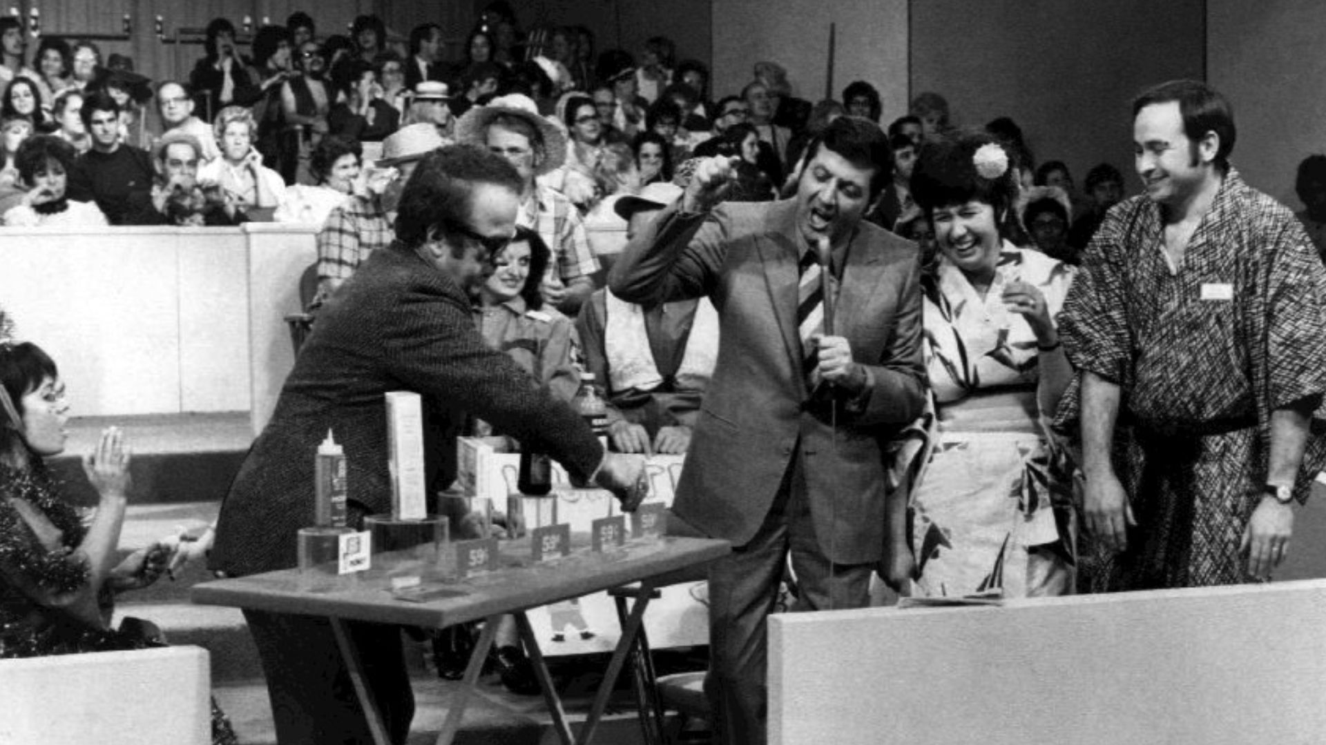 Publicity photo from the television show Let's Make a Deal. Pictured are host Monty Hall and announcer Jay Stewart with contestants.