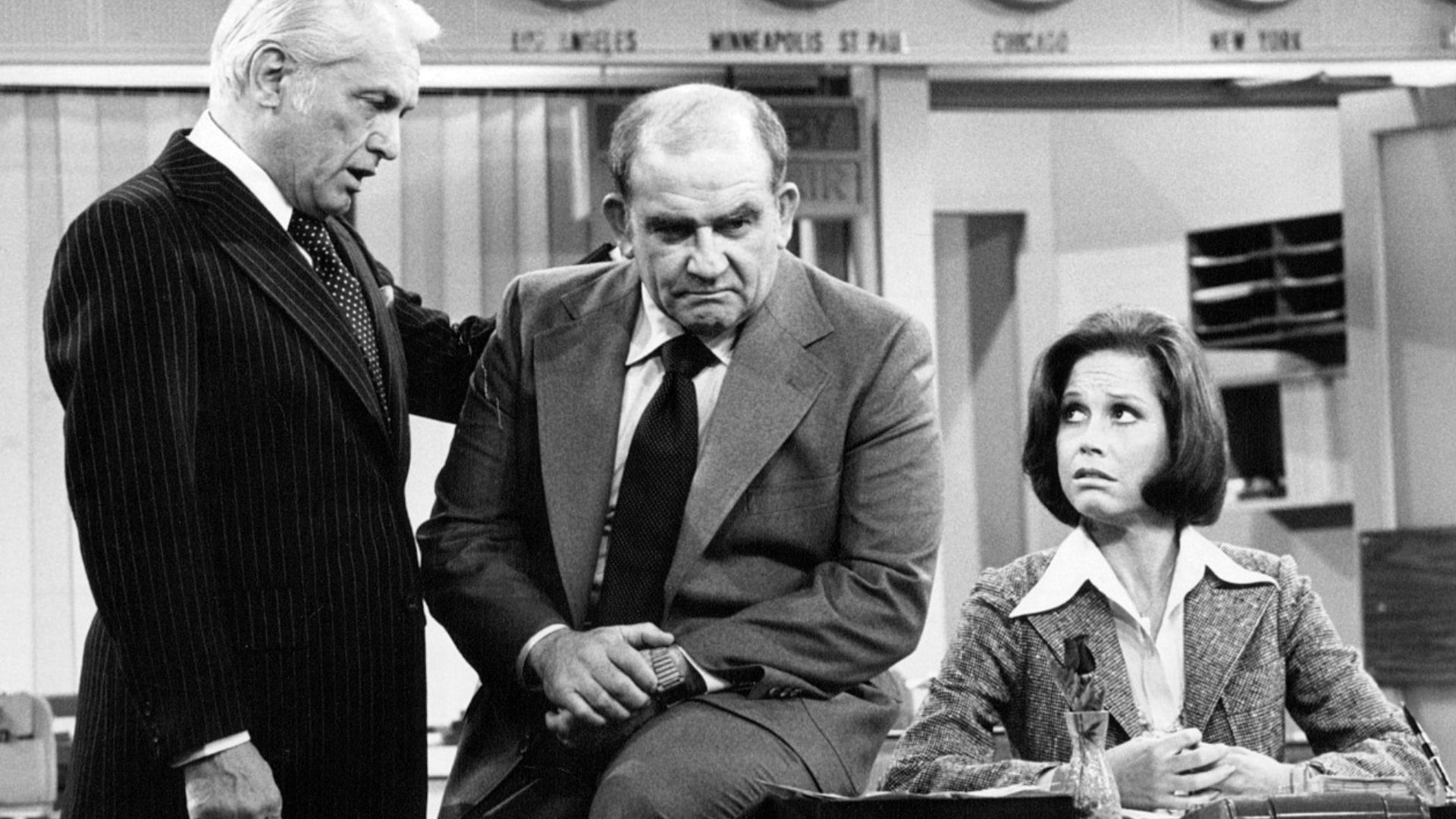 Photo of Ted Knight as Ted Baxter, Ed Asner as Lou Grant and Mary Tyler Moore as Mary Richards from the last episode of The Mary Tyler Moore Show-