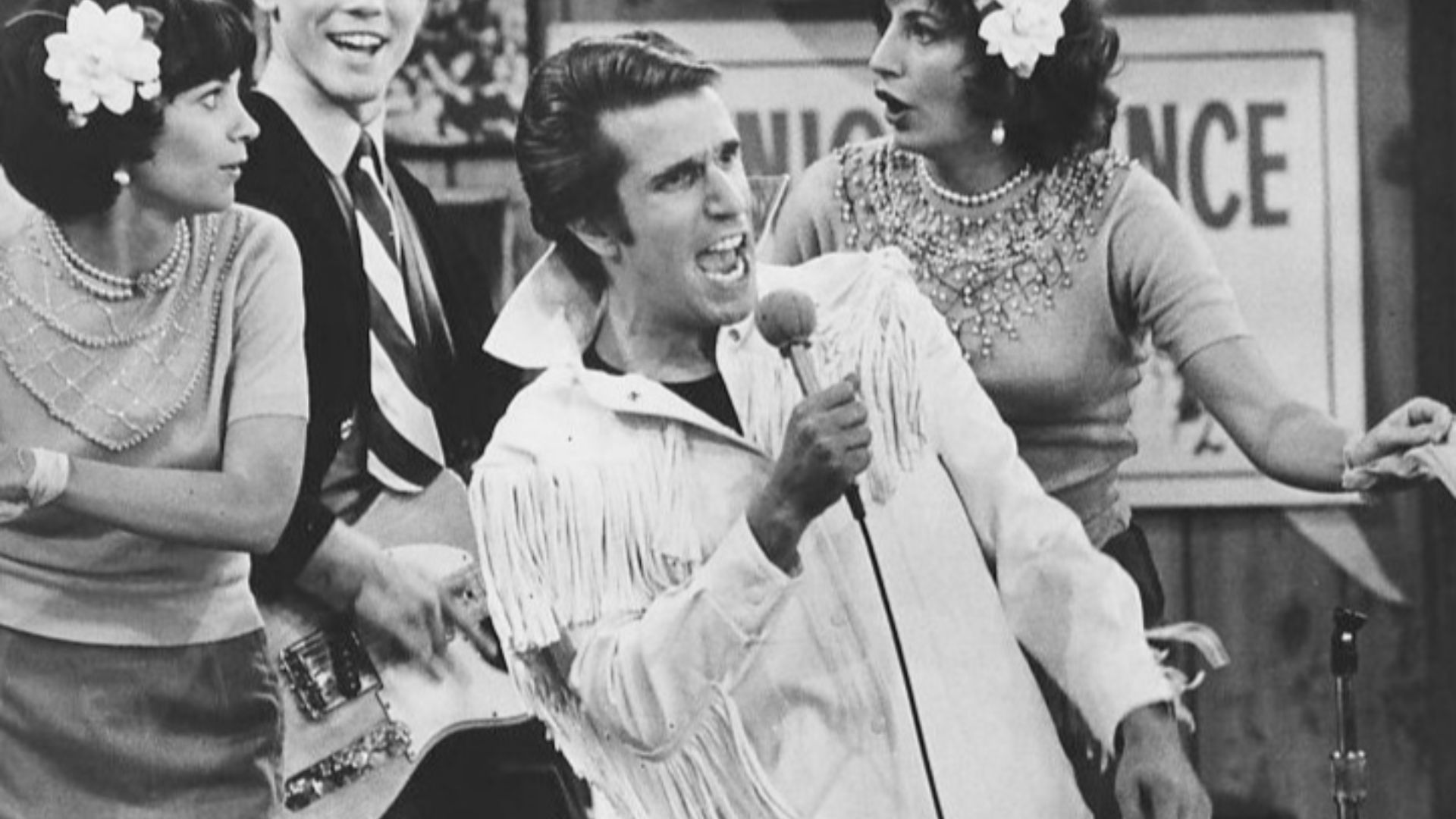 Photo from Happy Days.  In this episode, The Fonz becomes a singing superstar.  Pictured are Cindy Williams as Shirley Feeney, Ron Howard as Richie Cunningham, Henry Winkler as Fonzie and Penny Marshall as Laverne DiFazio.