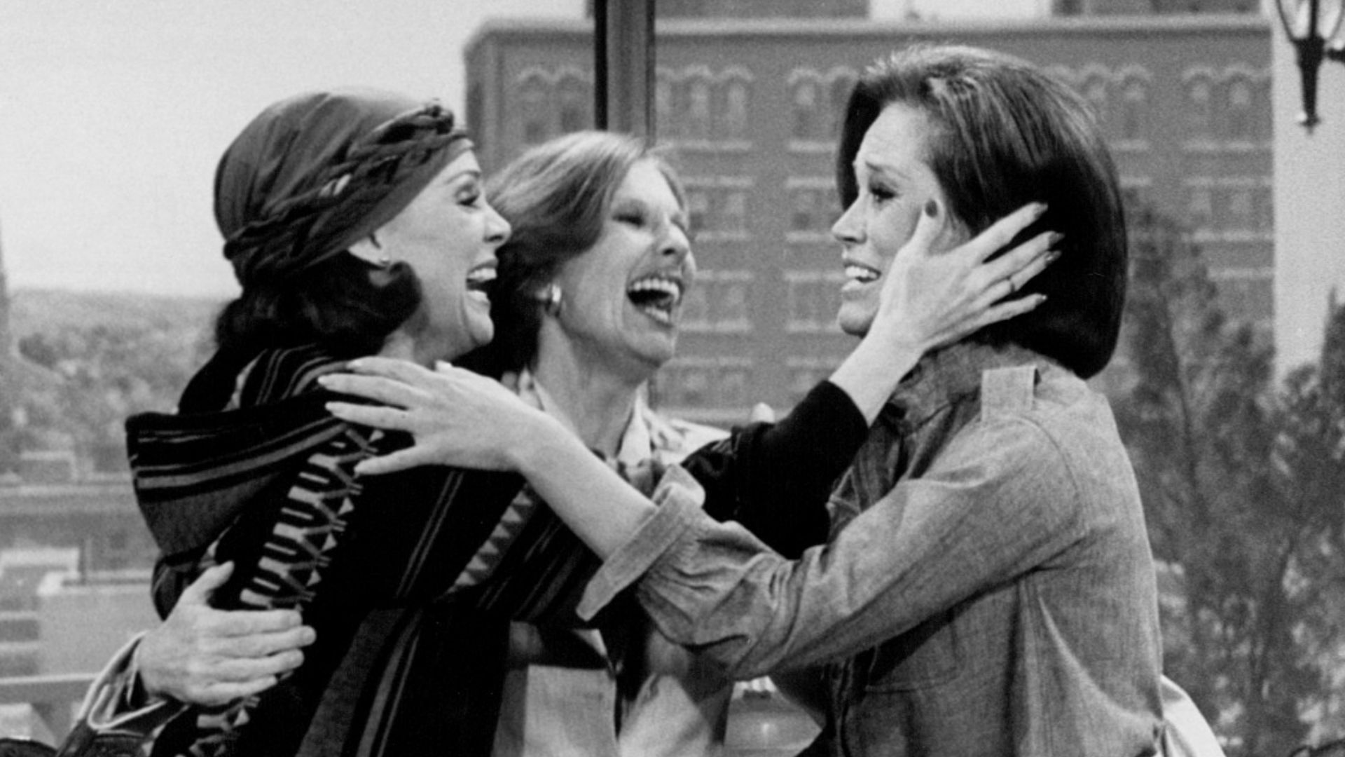 Photo from the last episode of The Mary Tyler Moore Show.  Rhoda Gerard (Valerie Harper, left) and Phyllis Lindstrom (Cloris Leachman, center) come to cheer up Mary Richards (Mary Tyler Moore) after hearing the news that WJM-TV has been sold and that she 