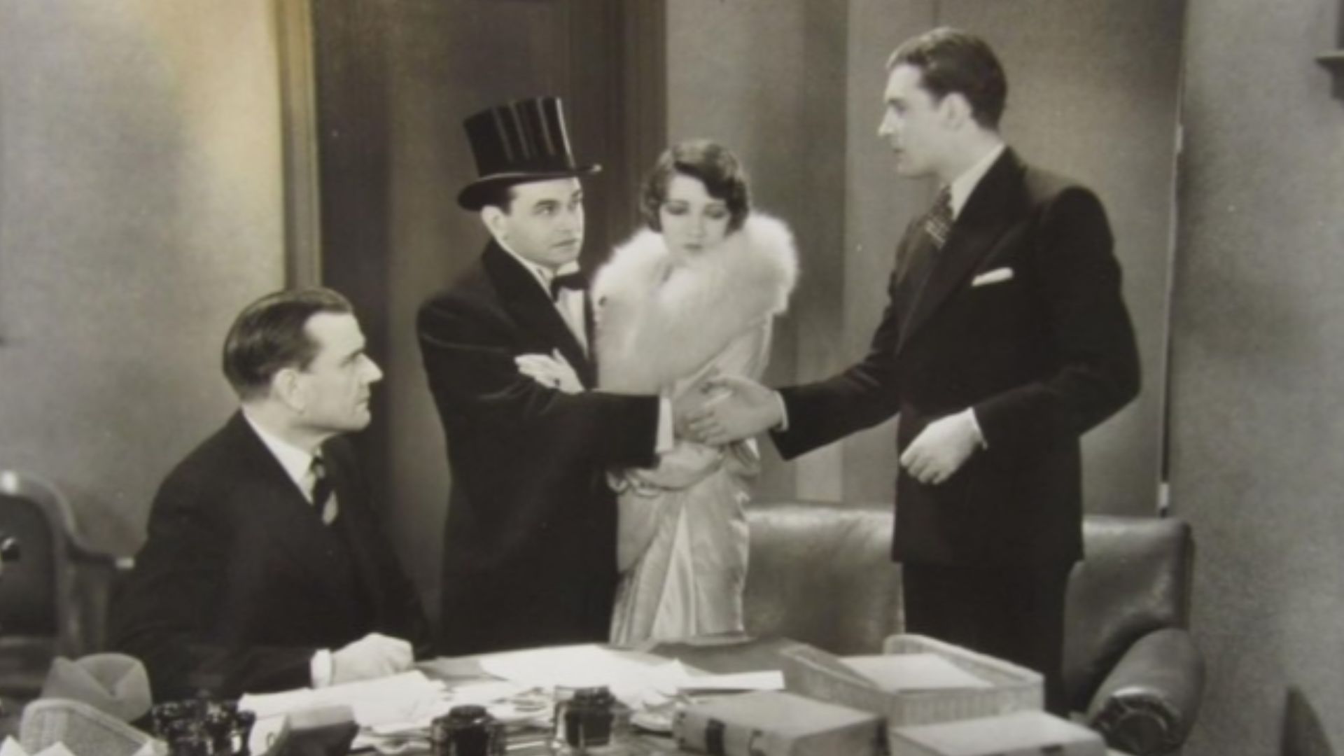 L. to R.: George MacQuarrie, Edward G. Robinson, Claudette Colbert & David Newell in The Hole in the Wall - publicity still (cropped)
