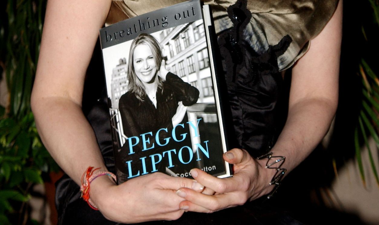 Peggy Lipton with a copy of her book