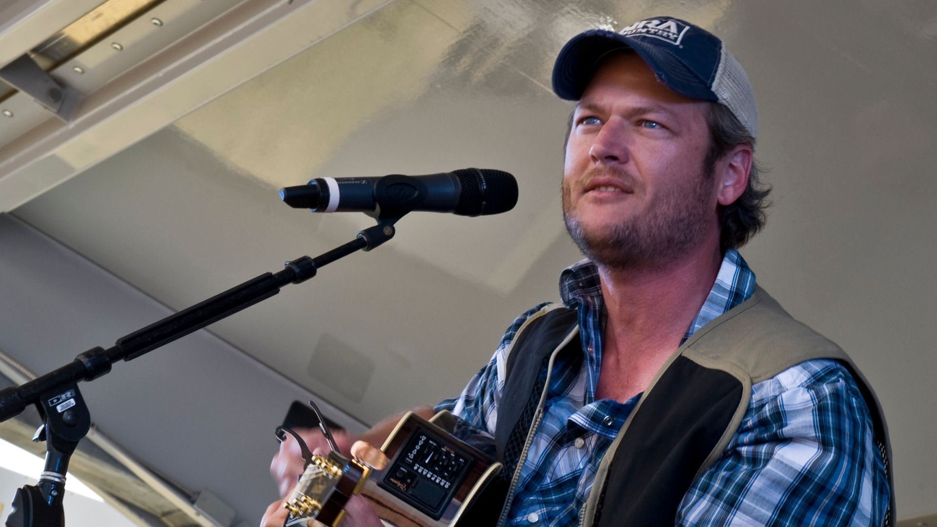 NELLIS AIR FORCE BASE, Nev. -- Country singer, Blake Shelton performs onstage during the Academy of Country Music USO concert at the Nellis sports pavilion April 2. Country music stars came to Nellis to participate in a charity skeet shooting event and pe