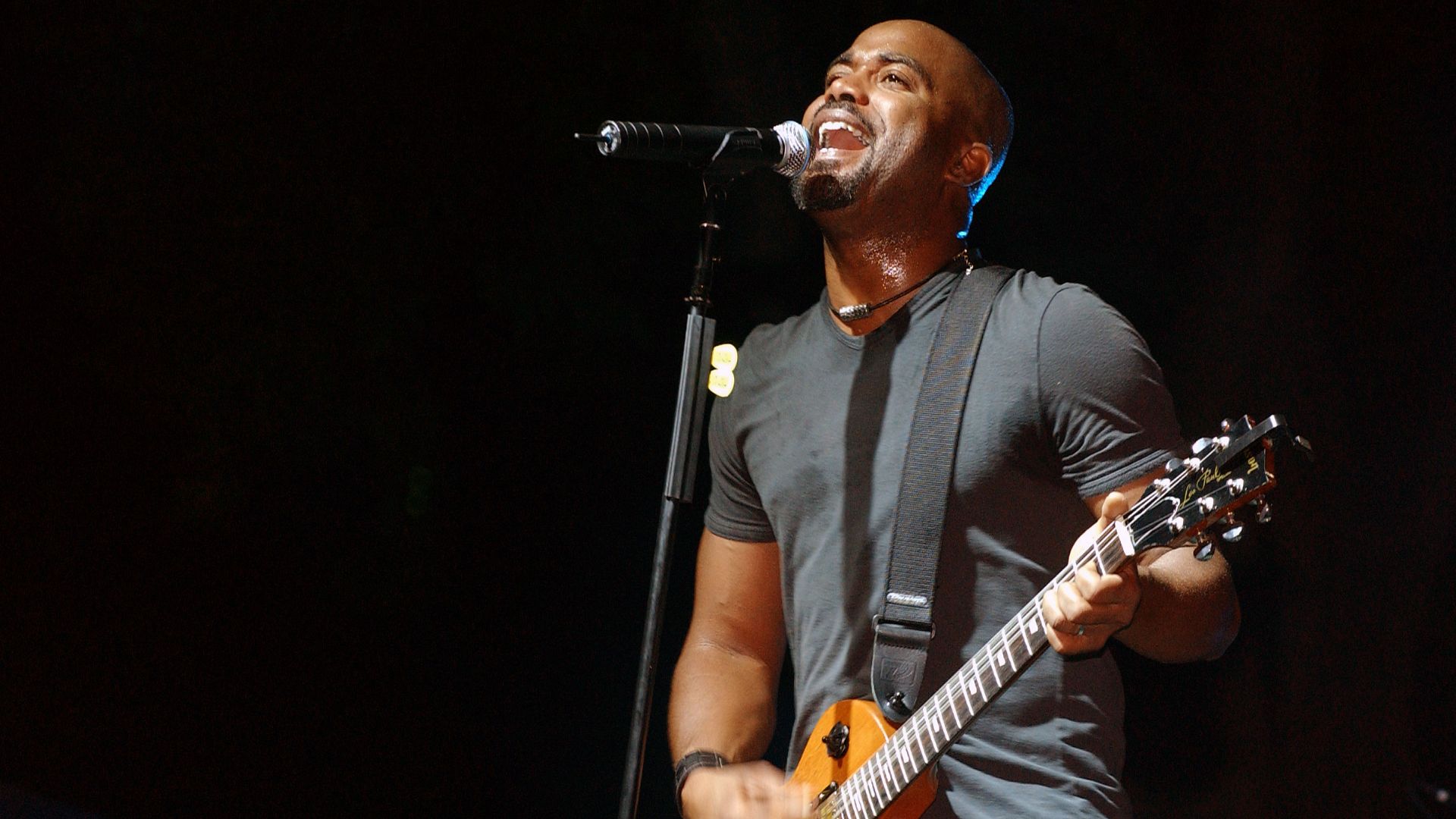 Hootie and the Blowfish lead singer Darius Rucker performs one of his many hit songs along with his band, during a free concert sponsored by the Air Force Reserve Command (AFRCOM) at Hickam Air Force Base (AFB), Hawaii (HI).