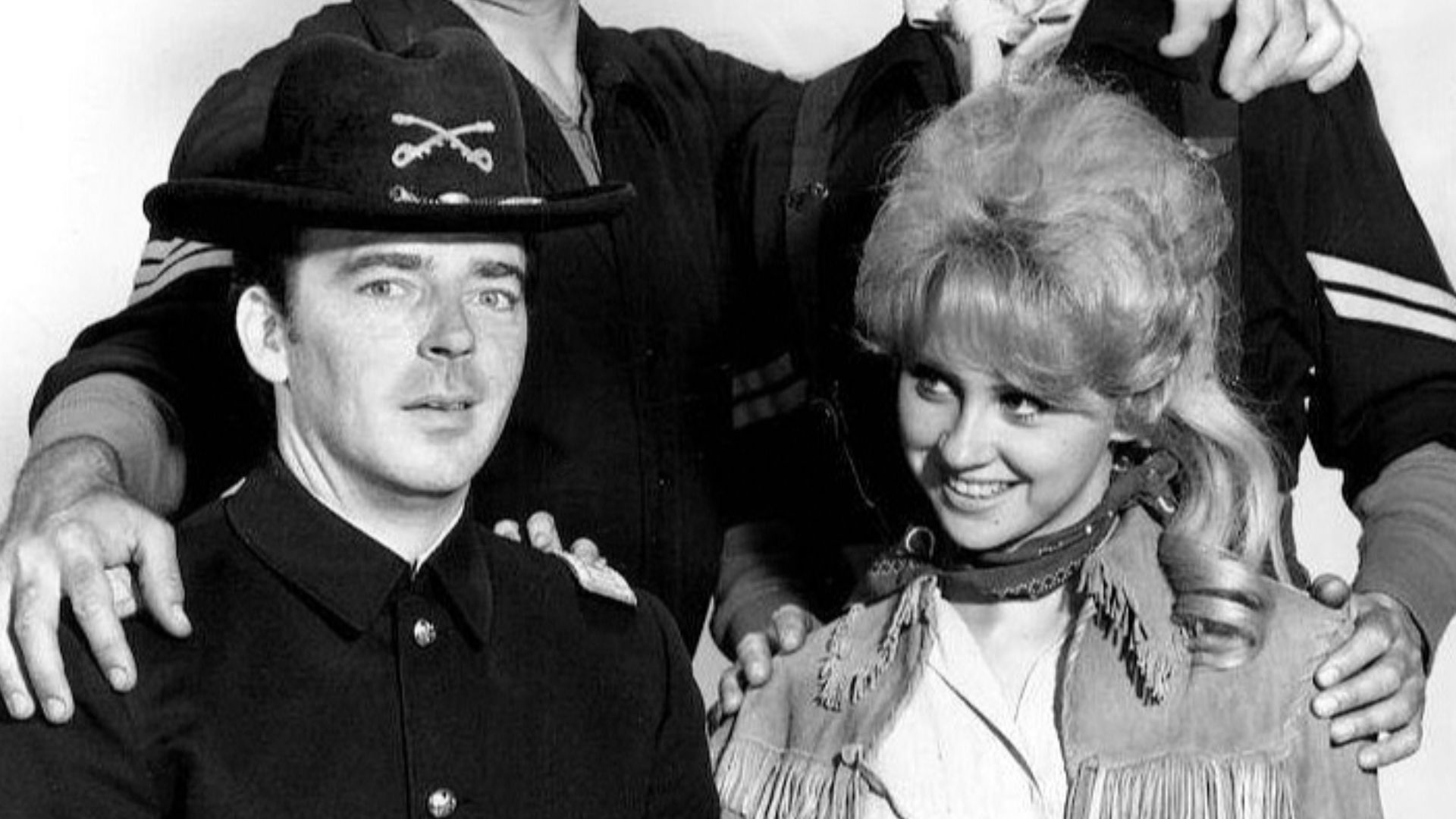 Main cast photo from the television program F Troop.  Standing from left: Forrest Tucker and Larry Storch. Seated: Ken Berry and Melody Patterson.