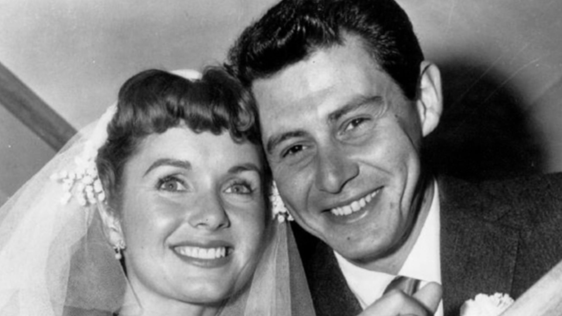 Press photo of Debbie Reynolds and Eddie Fisher at their wedding.