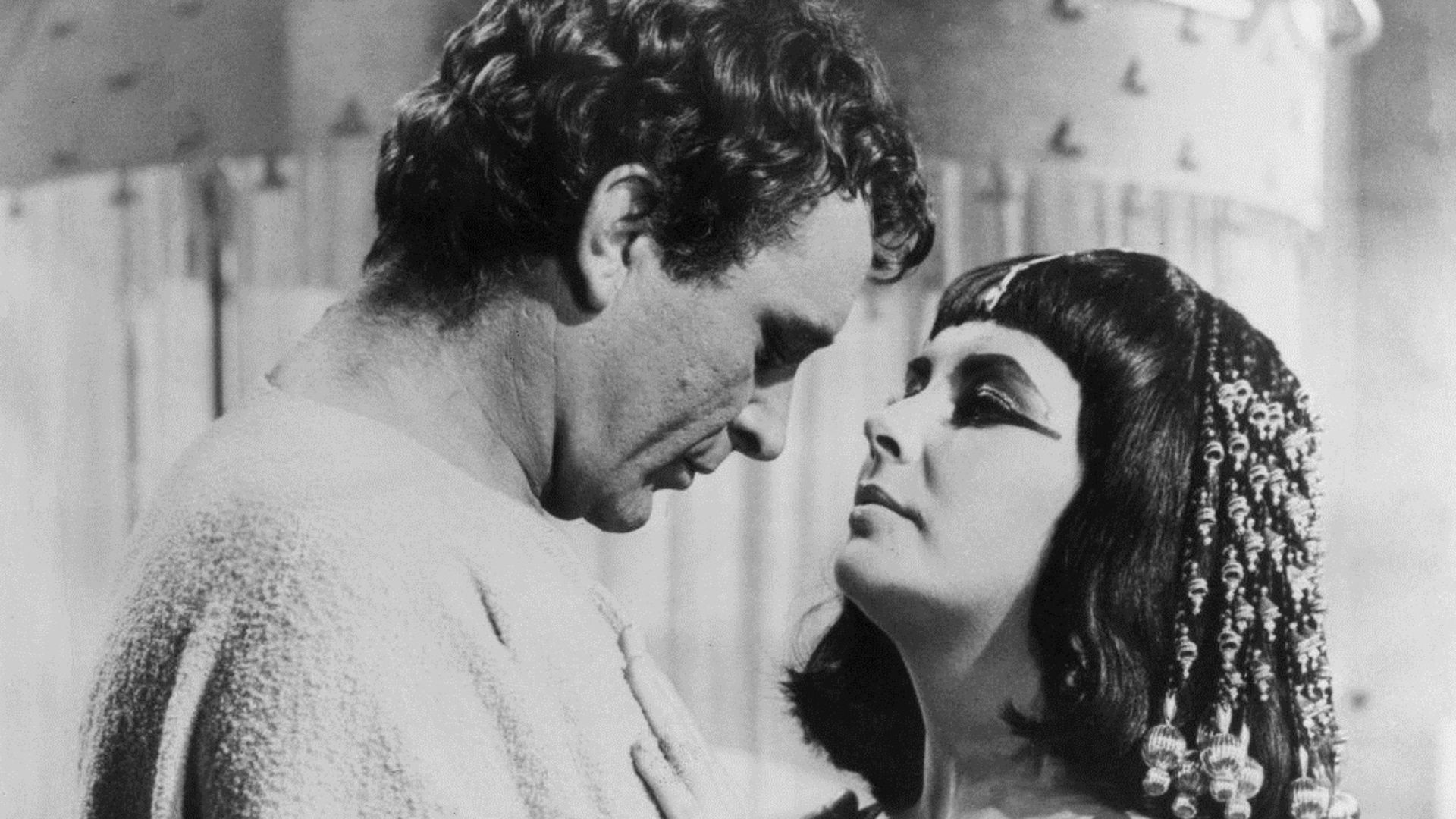 Photo of Richard Burton and Elizabeth Taylor in Cleopatra.  Photo published by The Courier-Gazette, McKinney Texas.
Note that the uploaded photo is larger and of better quality than the newspaper photo.
A search was done for renewal at copyright.gov using
