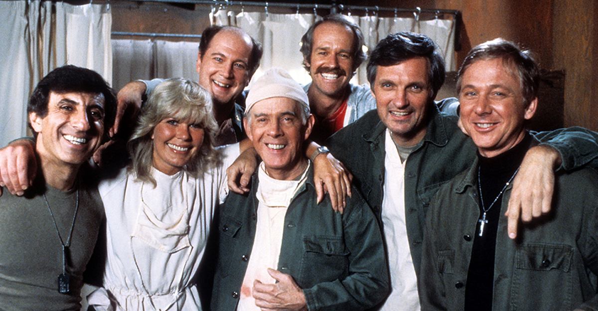 Jamie Farr, Loretta Swit, David Ogden Stiers, Harry Morgan, Mike Farrell, Alan Alda, and William Christopher in publicity portrait for the film 'M*A*S*H', Circa 1978