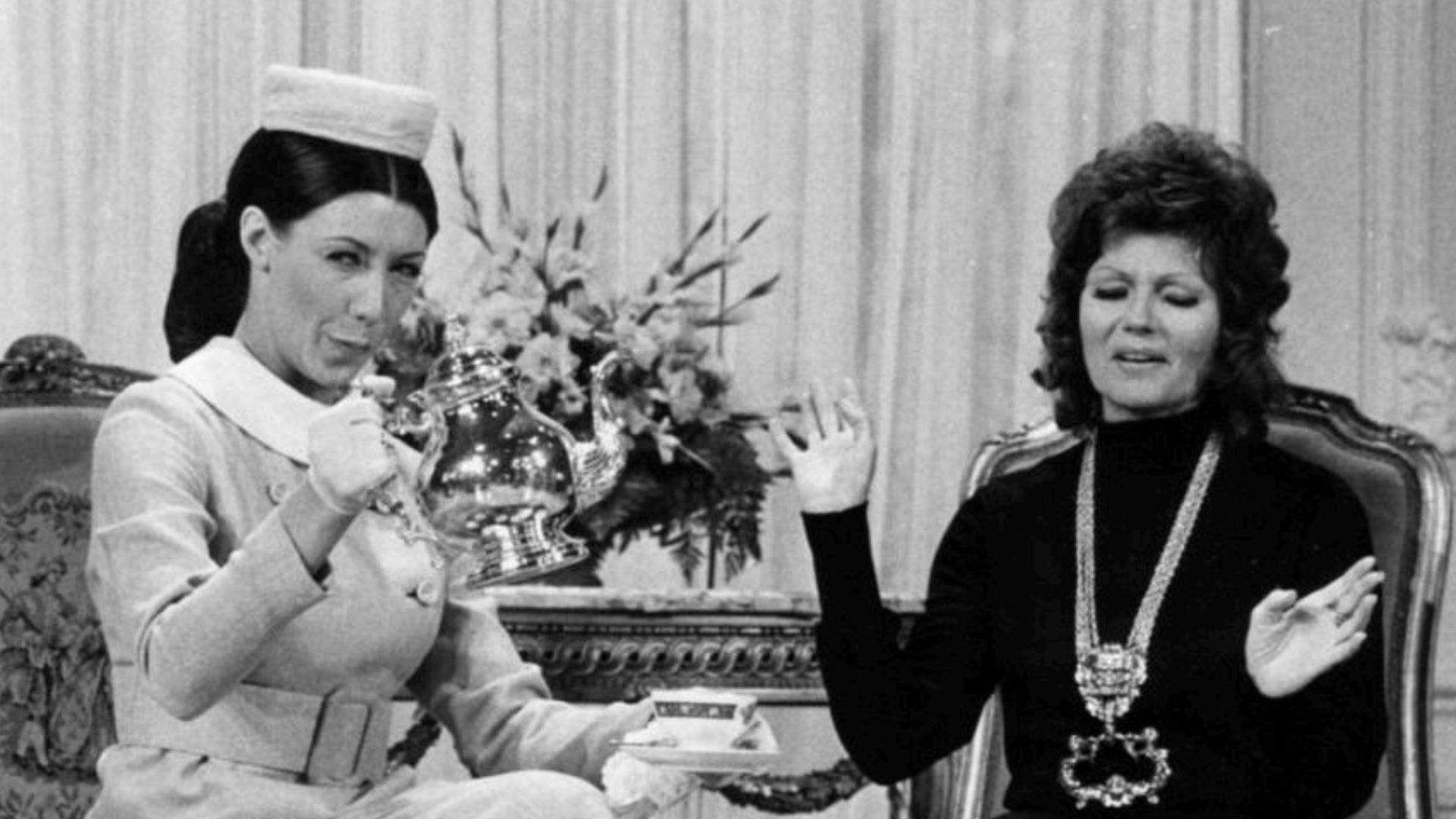 Publicity photo of Lily Tomlin as Mrs. Earbore, the Tasteful Lady, and Rita Hayworth from the television program Rowan & Martin's Laugh-In.