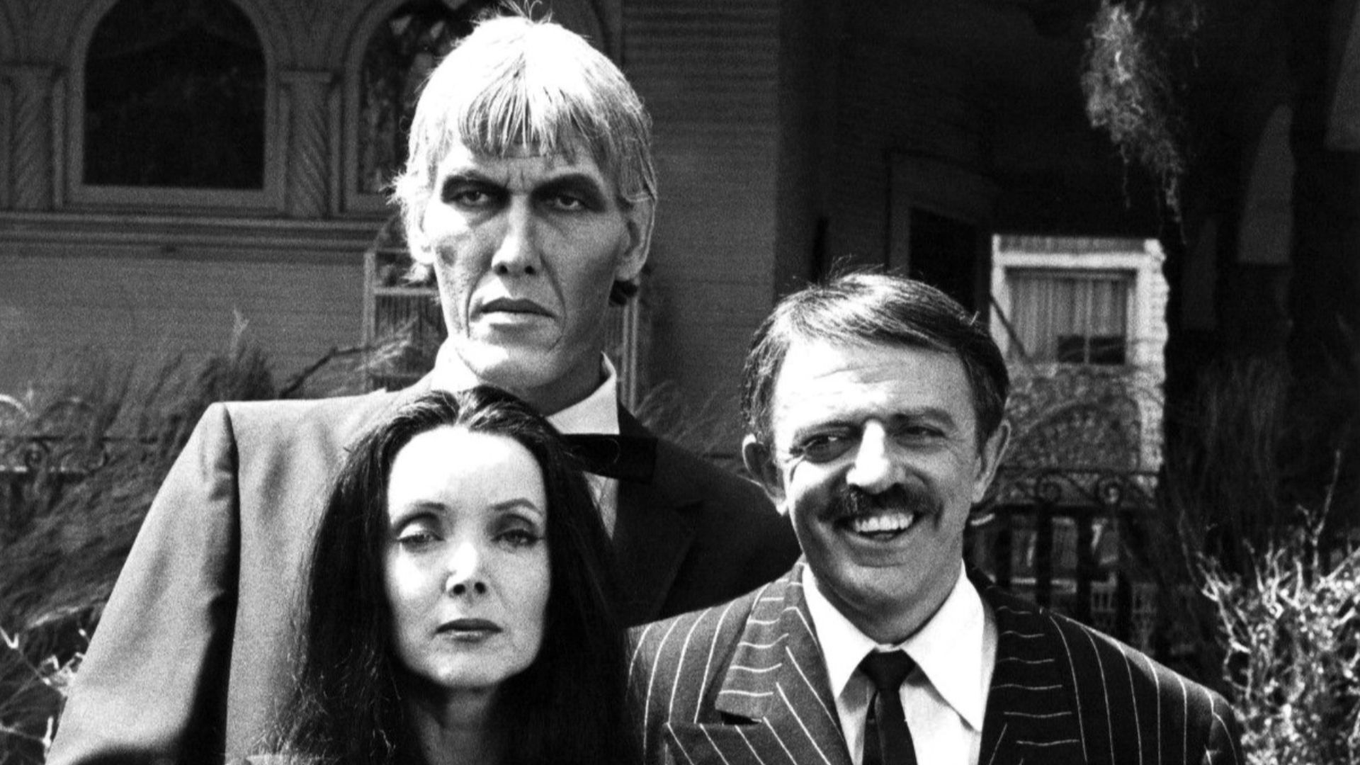 Photo of the main cast of the television program The Addams Family.  From left-Ted Cassidy (Lurch), Carolyn Jones (Morticia) and John Astin (Gomez).  In 1977, NBC reunited the original cast of the series for a Halloween Big Event Special.  This photo is f