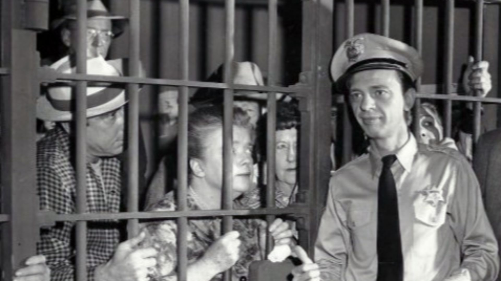 Photo from the television program The Andy Griffith Show.  When Andy returns from a trip, he finds that Barney has managed to put all of Mayberry's citizens behind bars in the town jail.