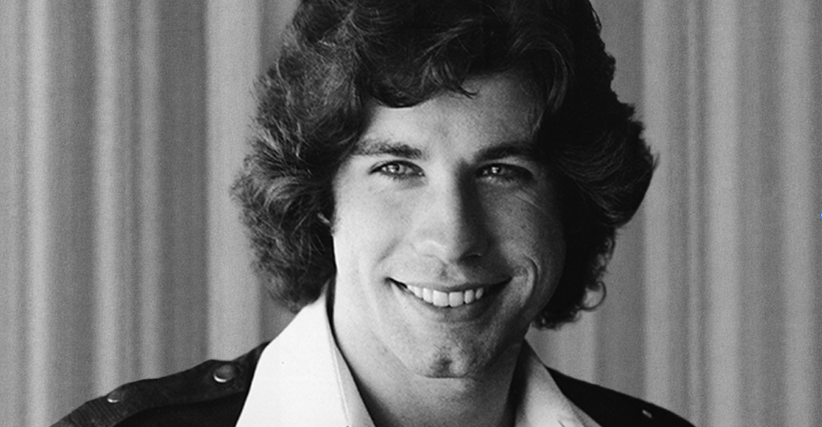 Actor John Travolta smiles in a photograph, late 1970s