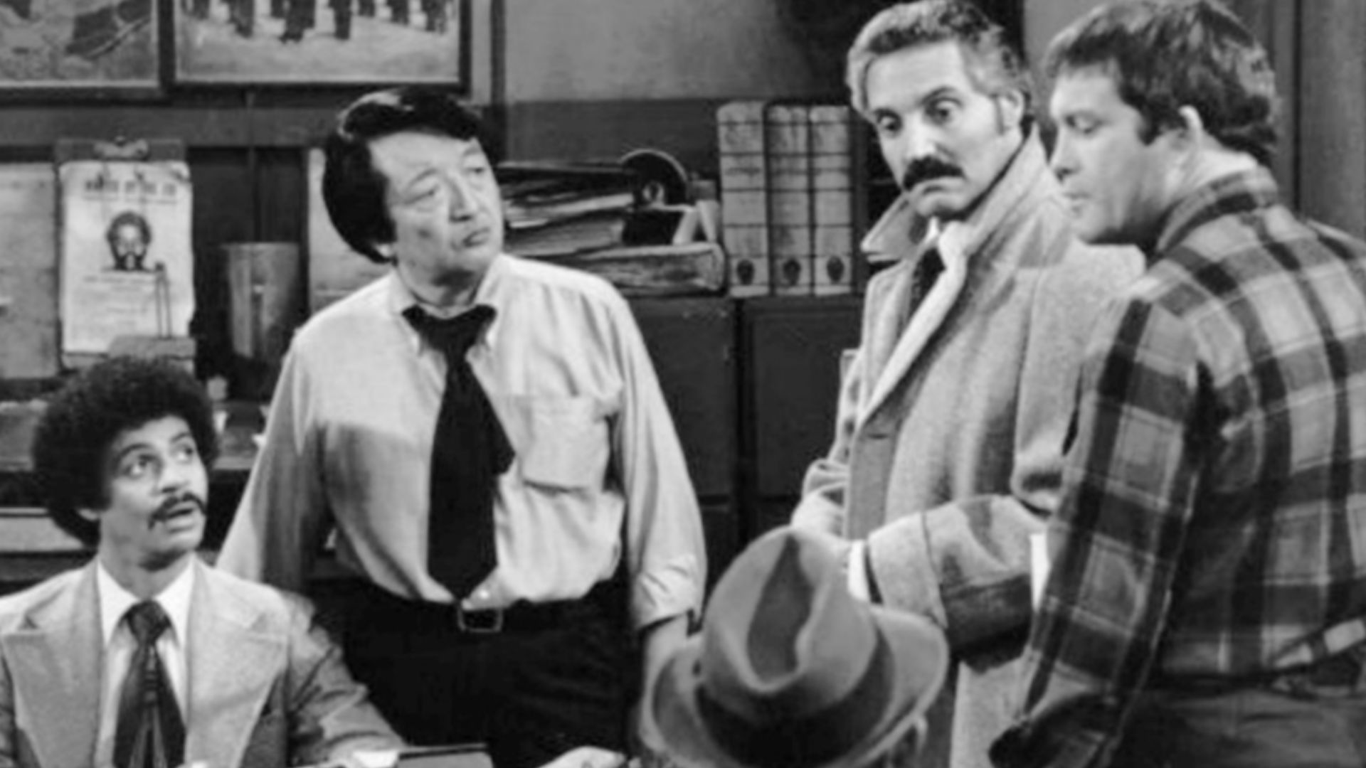 Cast photo from the television series Barney Miller Clockwise from left: Ron Glass (Ron Harris}, Jack Soo (Nick Yemana), Barney Miller (Hal Linden), Max Gail (