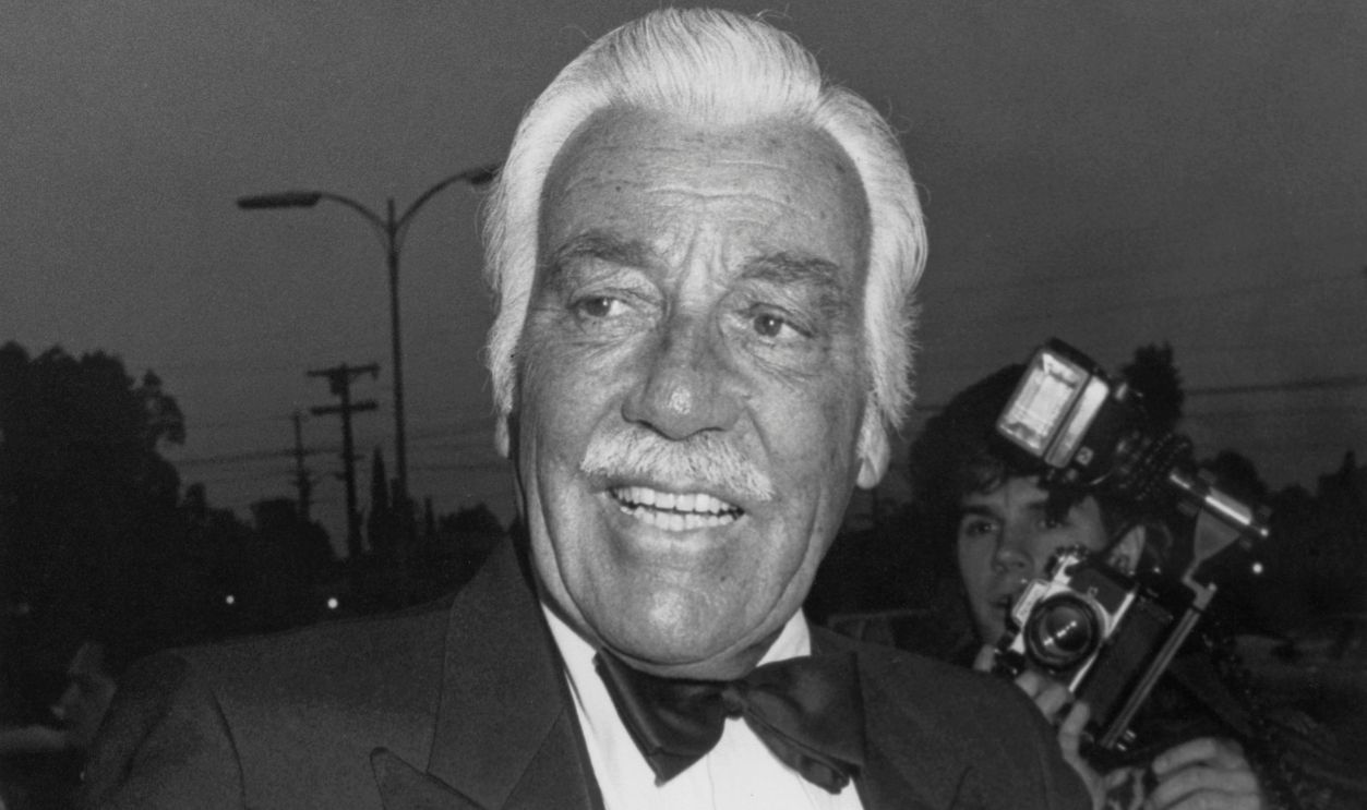 American actor and singer Cesar Romero (1907 - 1994) attends a party for the television soap opera 'Falcon Crest' in Los Angeles, USA, circa 1987. He plays Peter Stavros, the husband of Angela Channing, on the show.