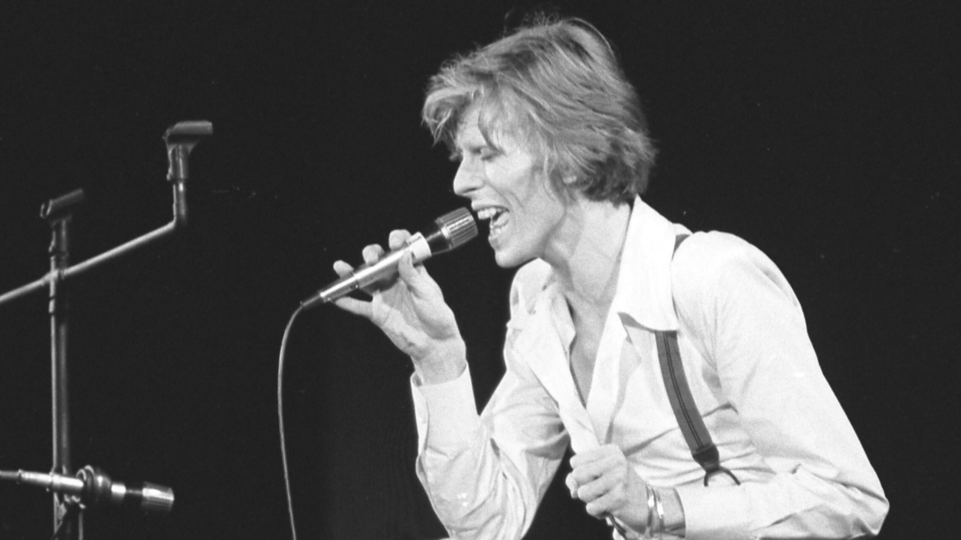 Eschewing special effects for this number, rock singer David Bowie establishes a mood in concert at Amphitheater.