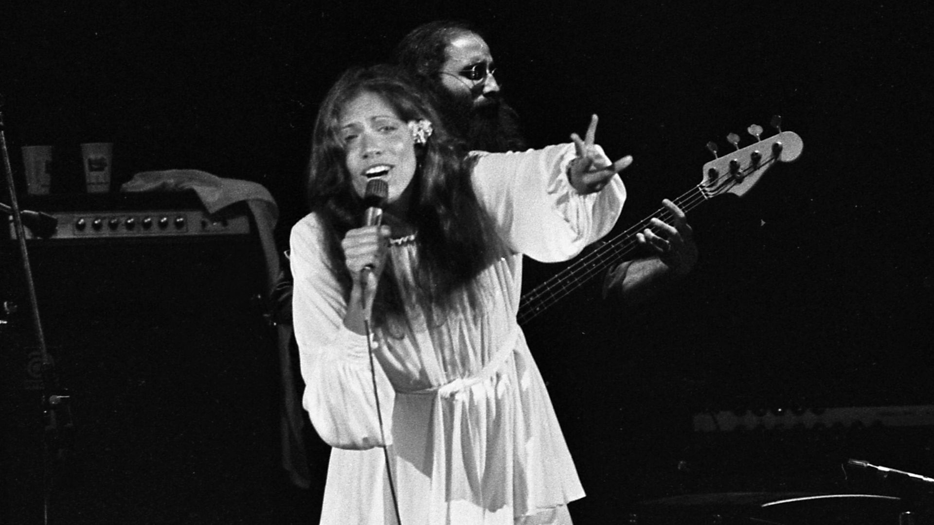 James Taylor and Carly Simon performing onstage in Los Angeles