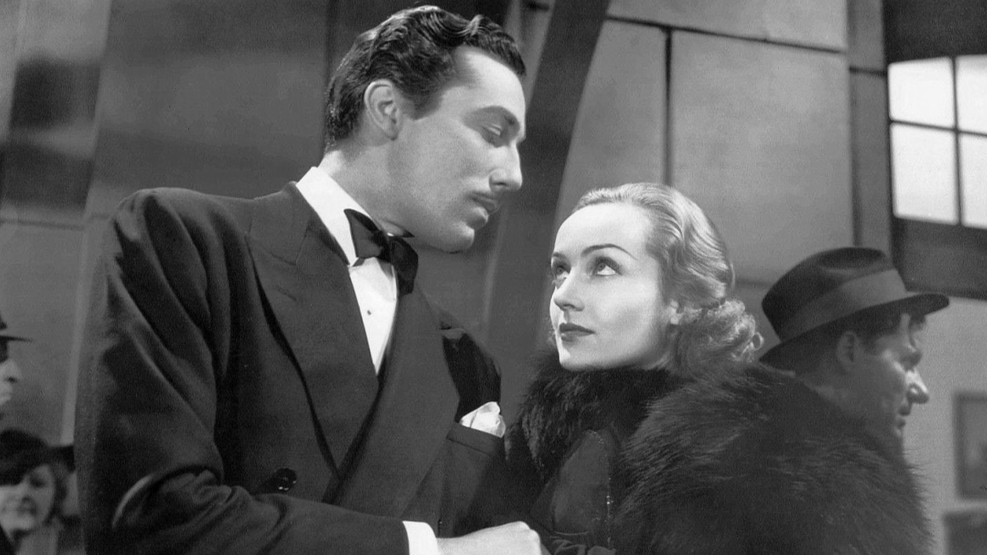 Cesar Romero & Carole Lombard in 1936 romantic comedy film Love Before Breakfast. See also film still. No copyright notice.